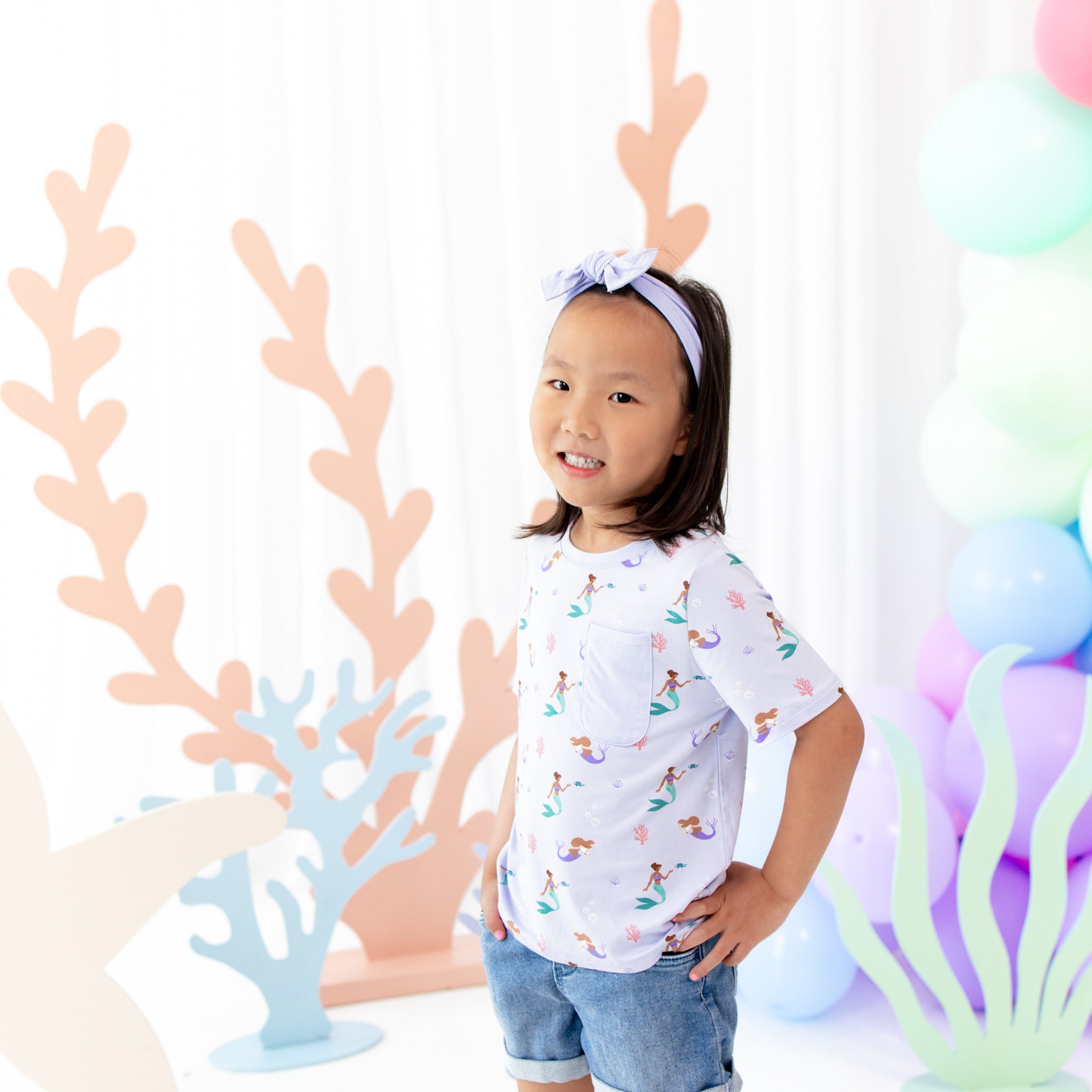 Girl wearing Kyte Baby Short Sleeve Toddler Crew Neck Tee in Mermaid