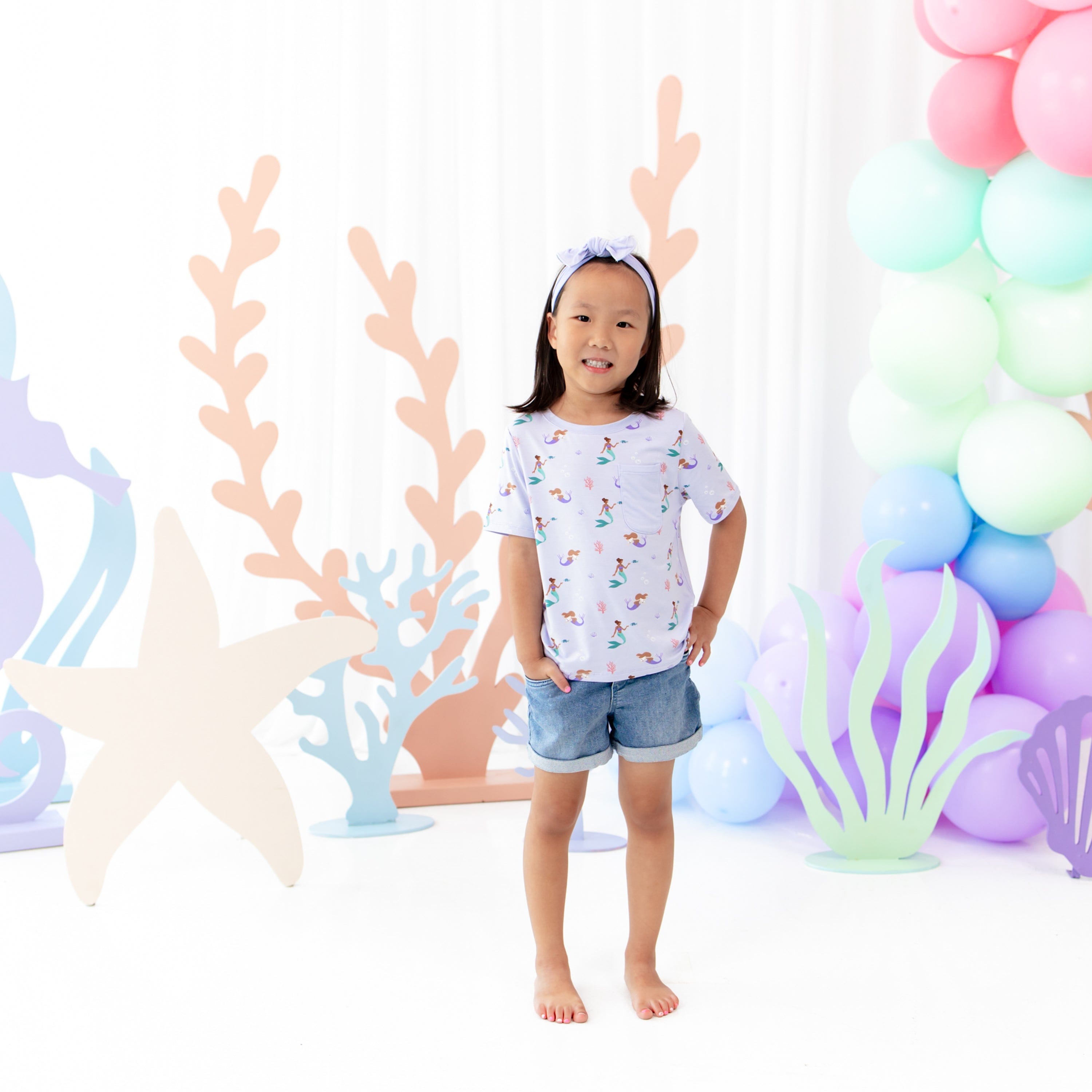 Child wearing Kyte Baby Toddler Crew Neck Tee with chest pocket in Mermaid