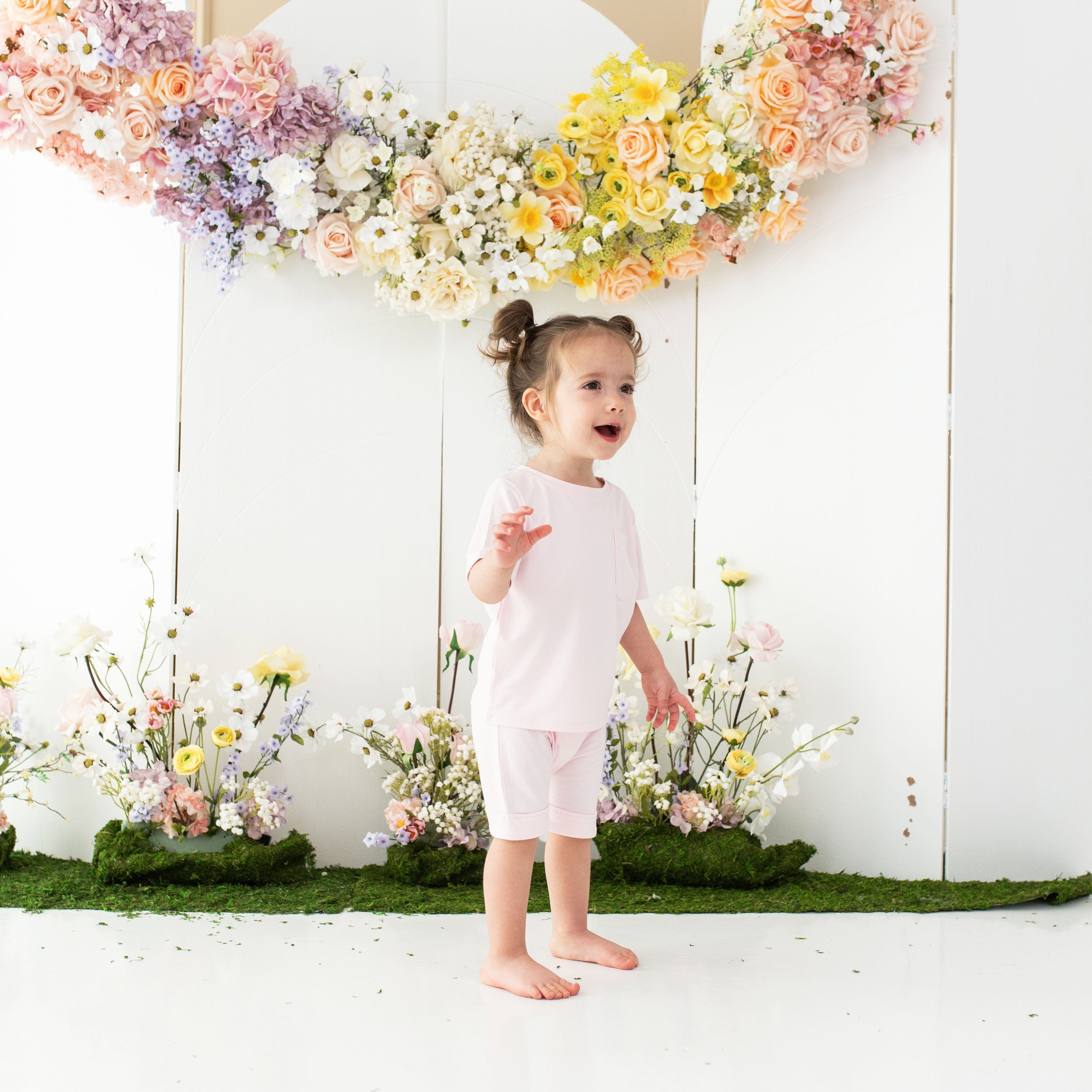 Toddler wearing Kyte Baby bamboo Short Sleeve Crew Neck Tee in Sakura