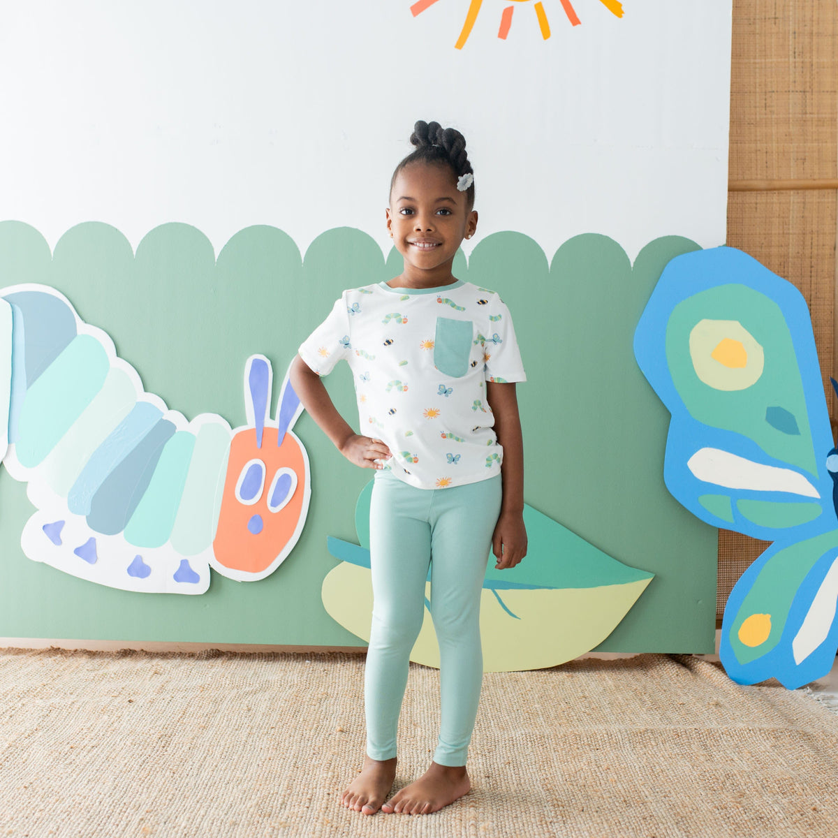 Girl wearing Kyte Baby Toddler Crew Neck Tee in The Very Hungry Caterpillar™ and Friends