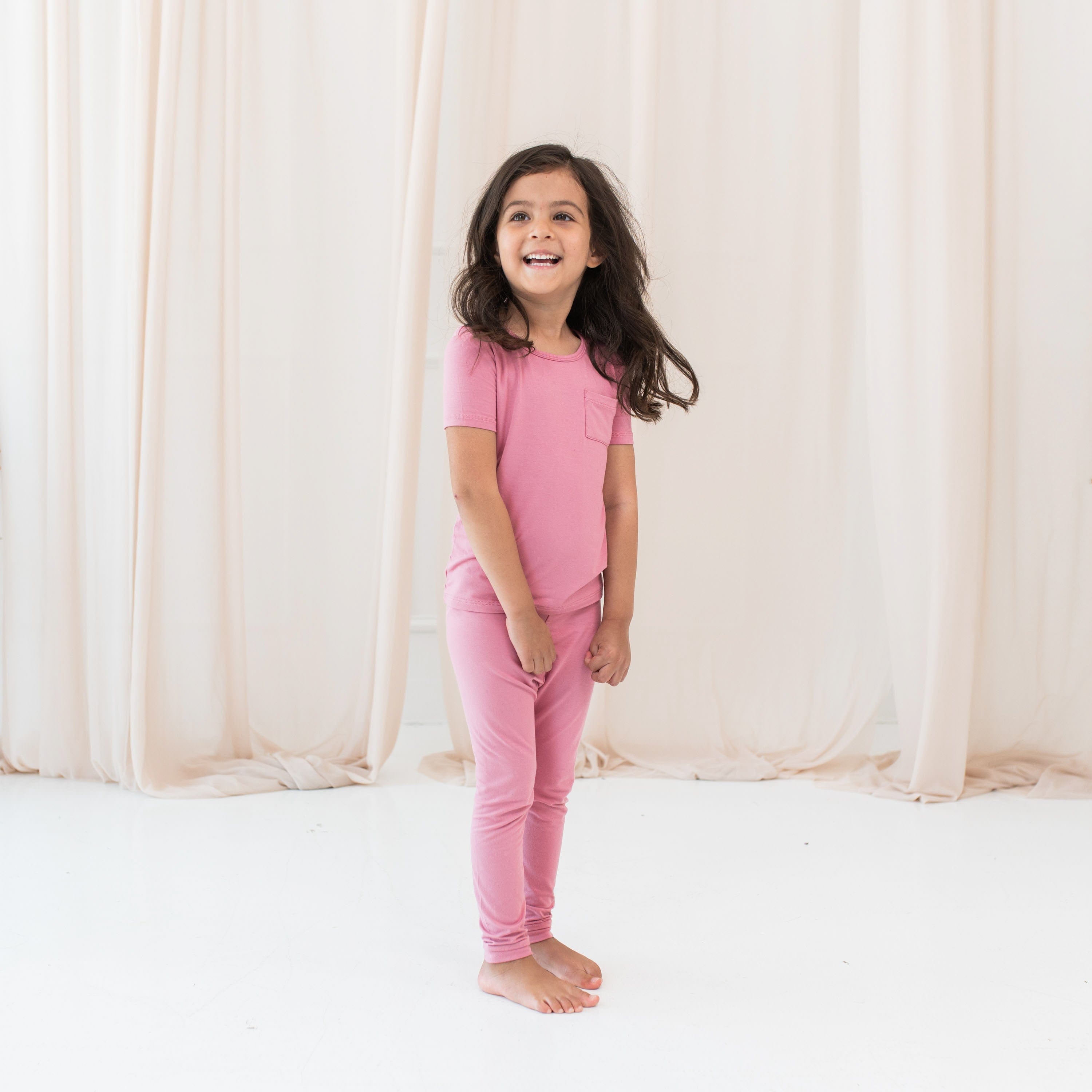 Child wearing Short Sleeve with Pants Kids Pajamas in Apple Blossom Pink