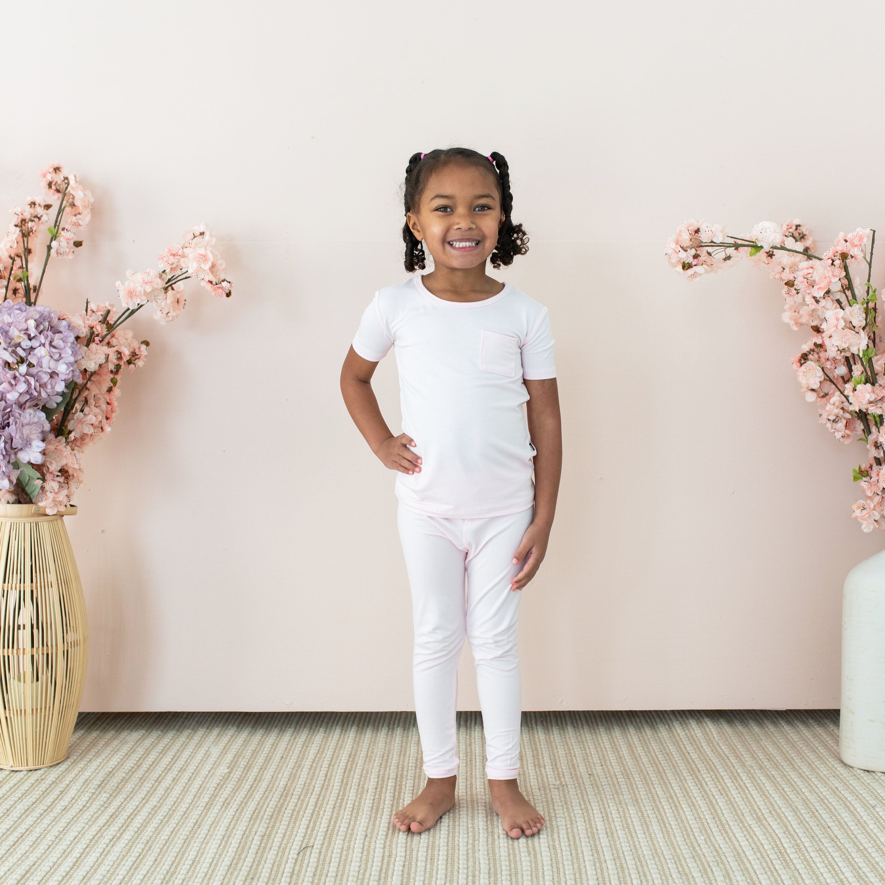 Toddler wearing Kyte Baby Short Sleeve with Pants Pajamas in Sakura