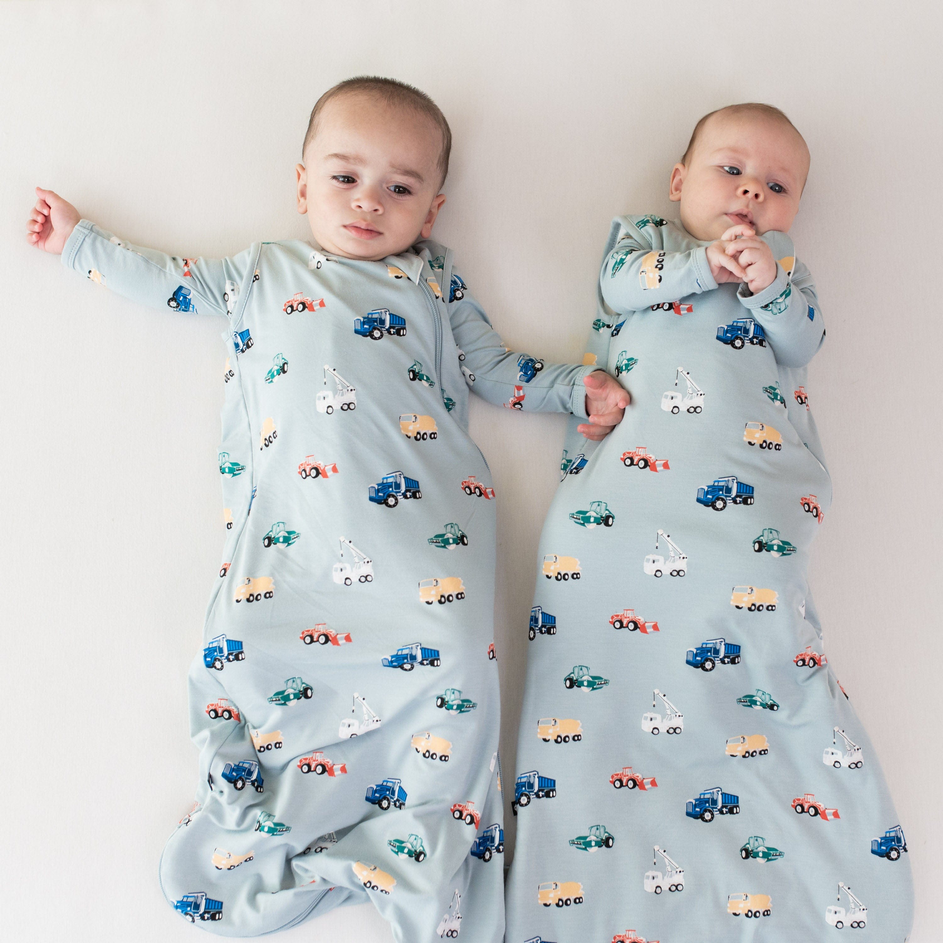 Babies wearing Kyte Baby sleep bags TOG 1.0 in Construction