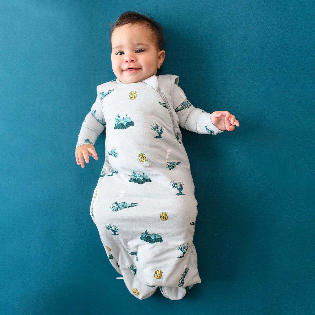 Infant modeling the Sleep Bag in Journey 1.0 wearing a Journey long sleeve romper underneath