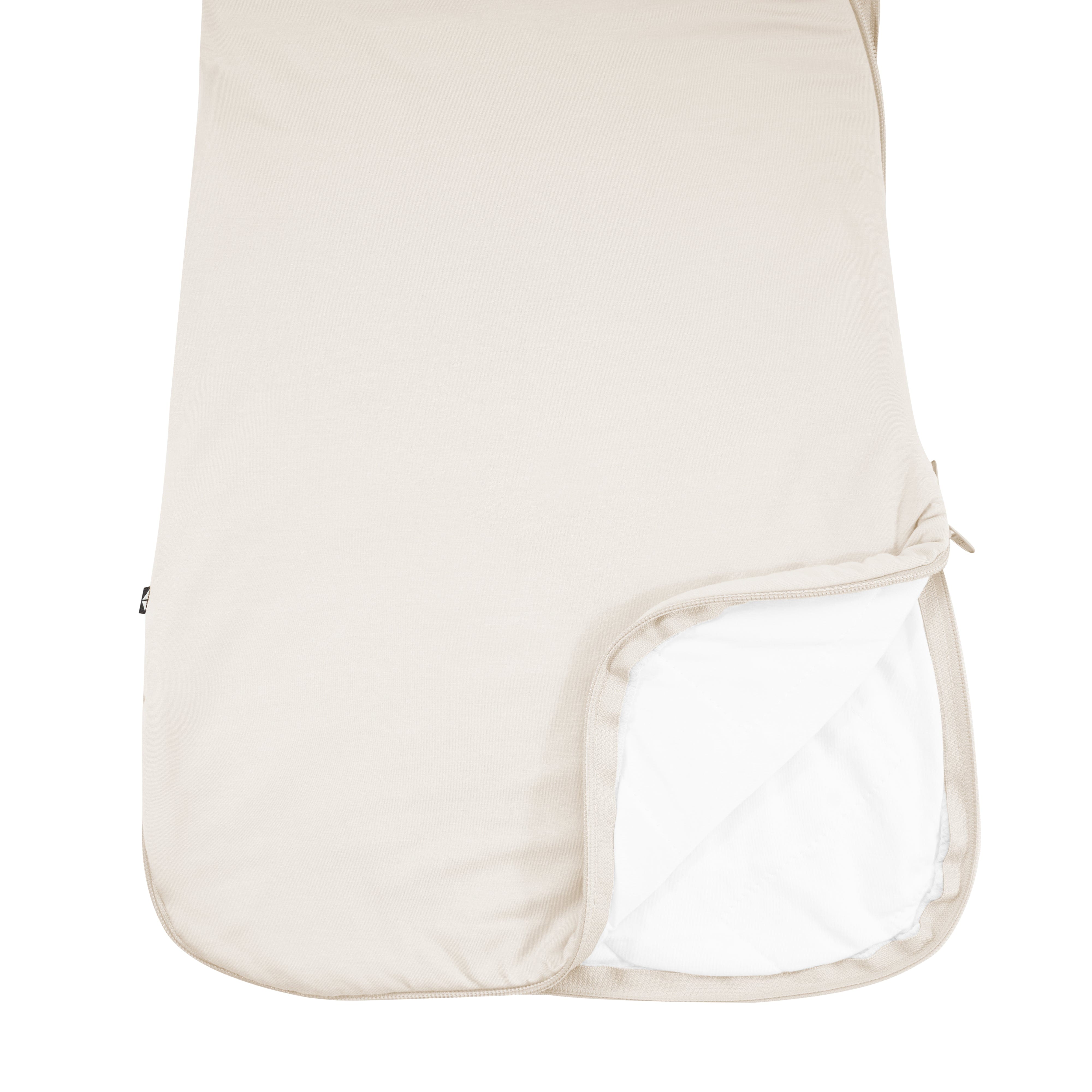 Close up double zipper on Kyte Baby Sleep Bag in Oat 1.0