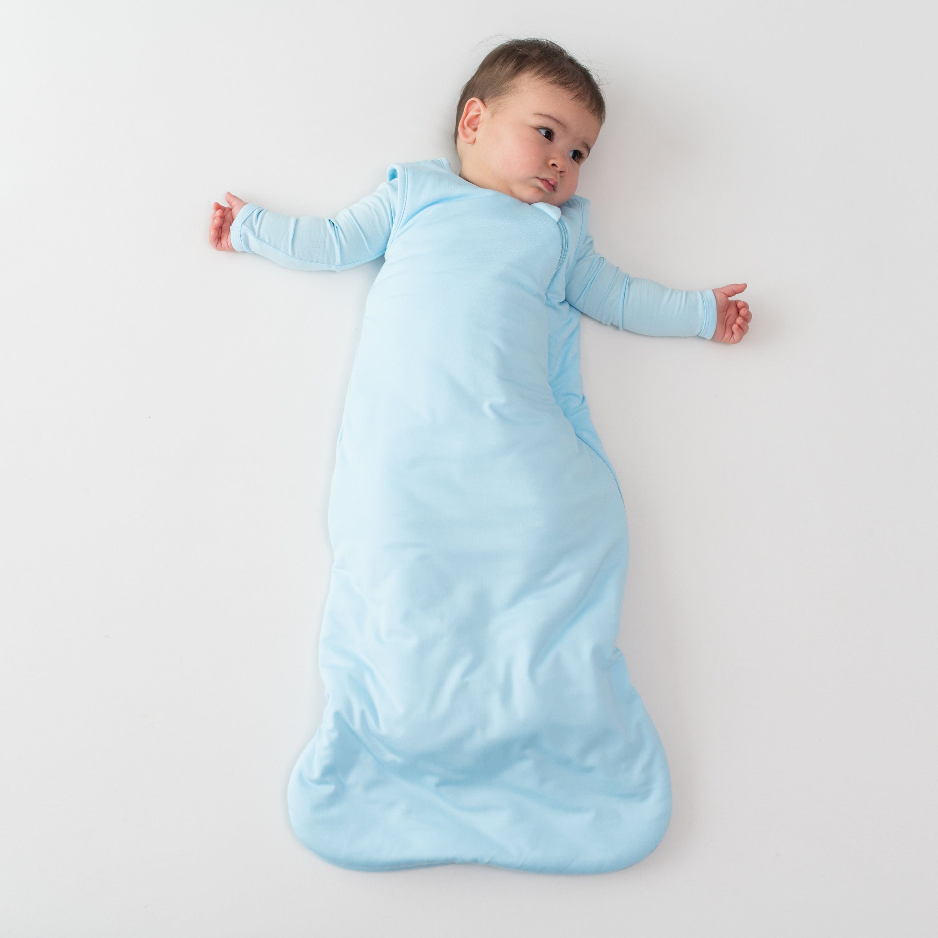 Baby wearing Kyte Baby bamboo TOG 1.0 Sleep Bag in Powder Blue
