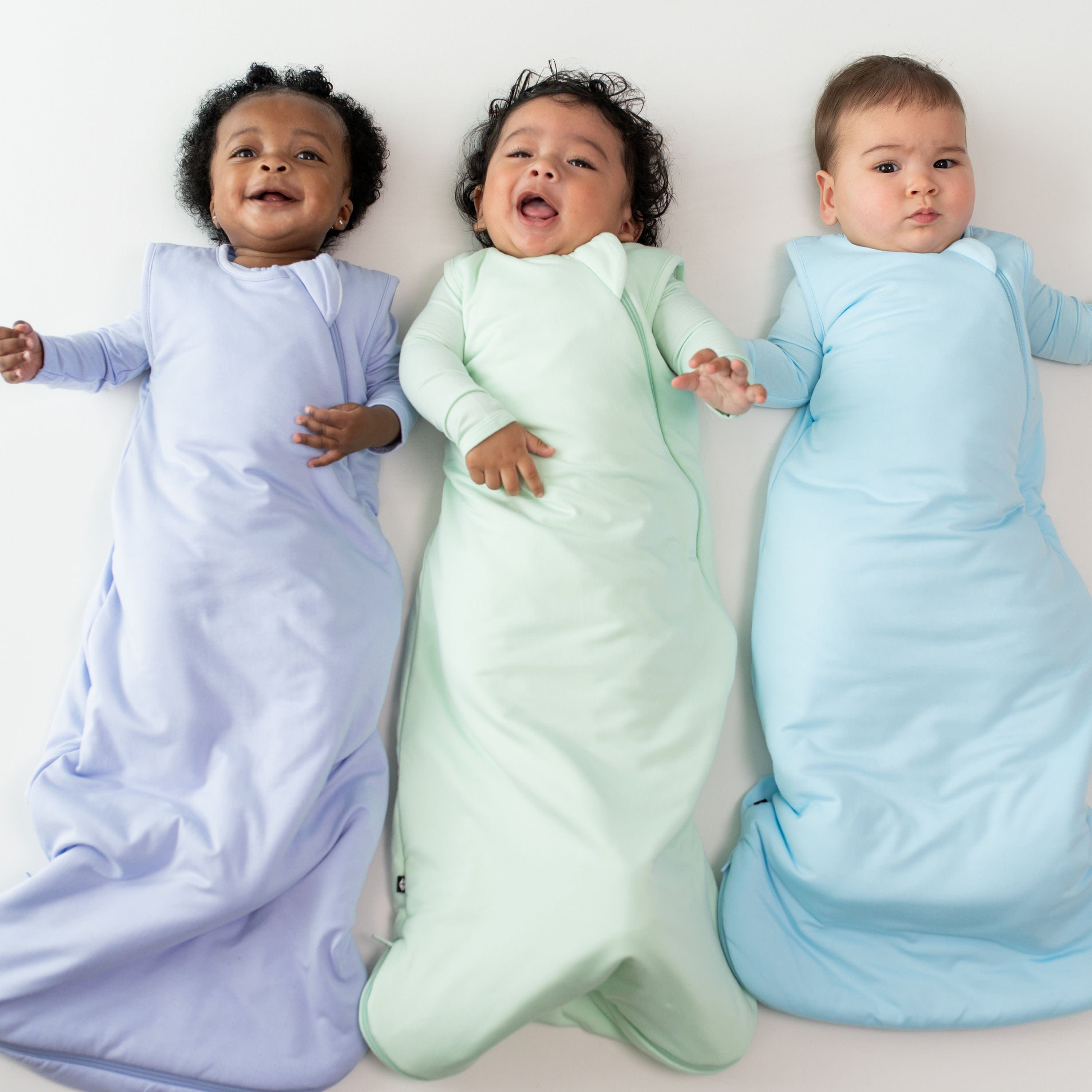 Babies wearing Kyte Baby sleep bags TOG 1.0