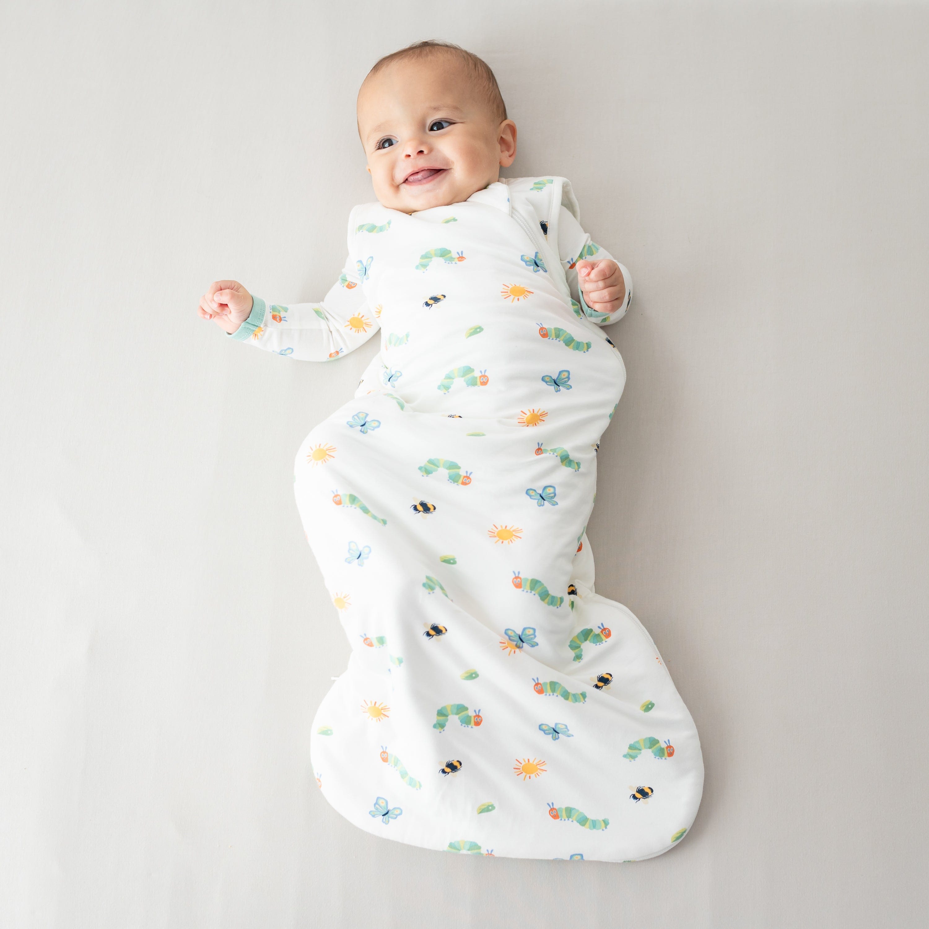 Newborn wearing Kyte Baby Sleep Bag in The Very Hungry Caterpillar™ and Friends TOG 1.0