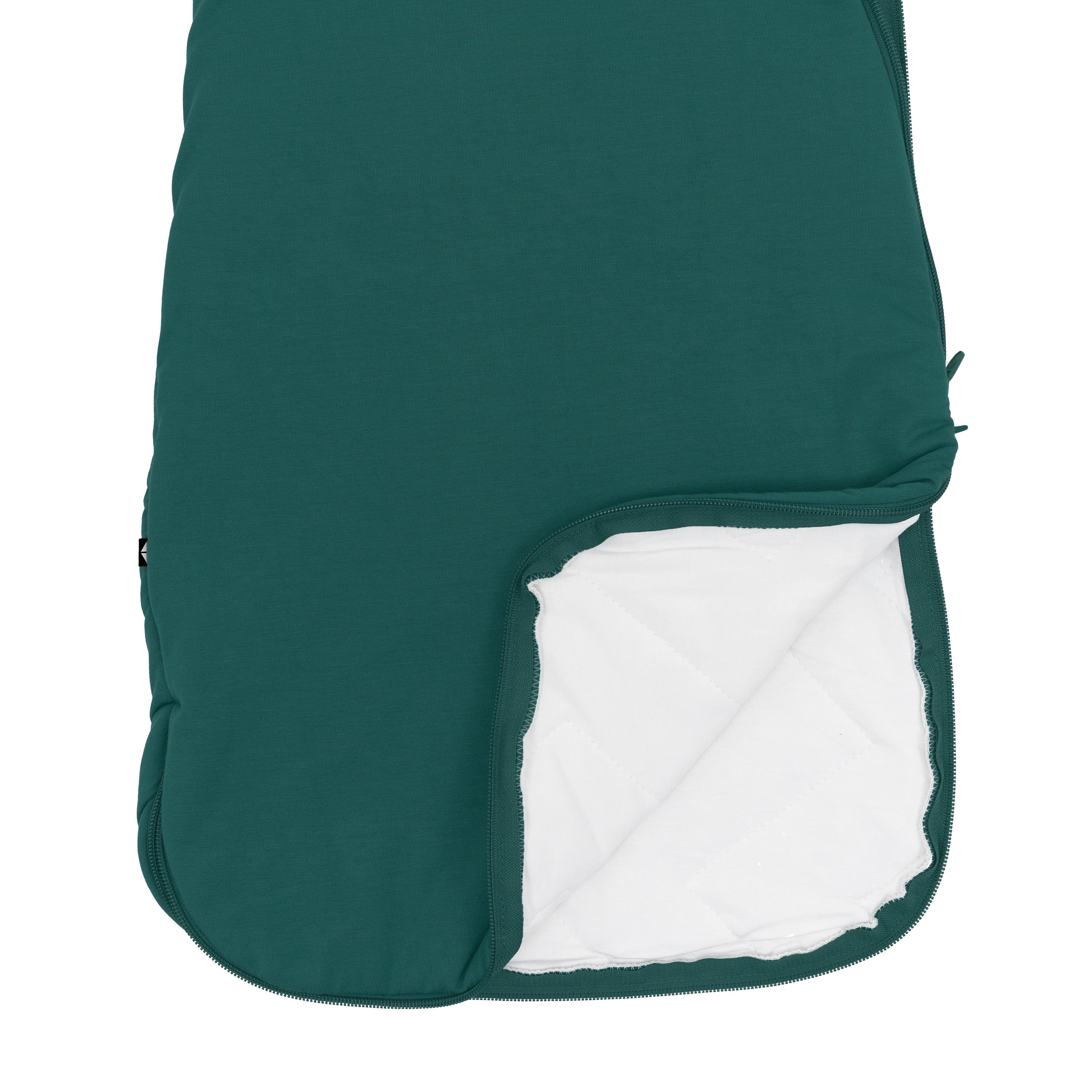 Unzipped dual zipper on bottom of Kyte Baby Sleep Bag in Emerald 2.5