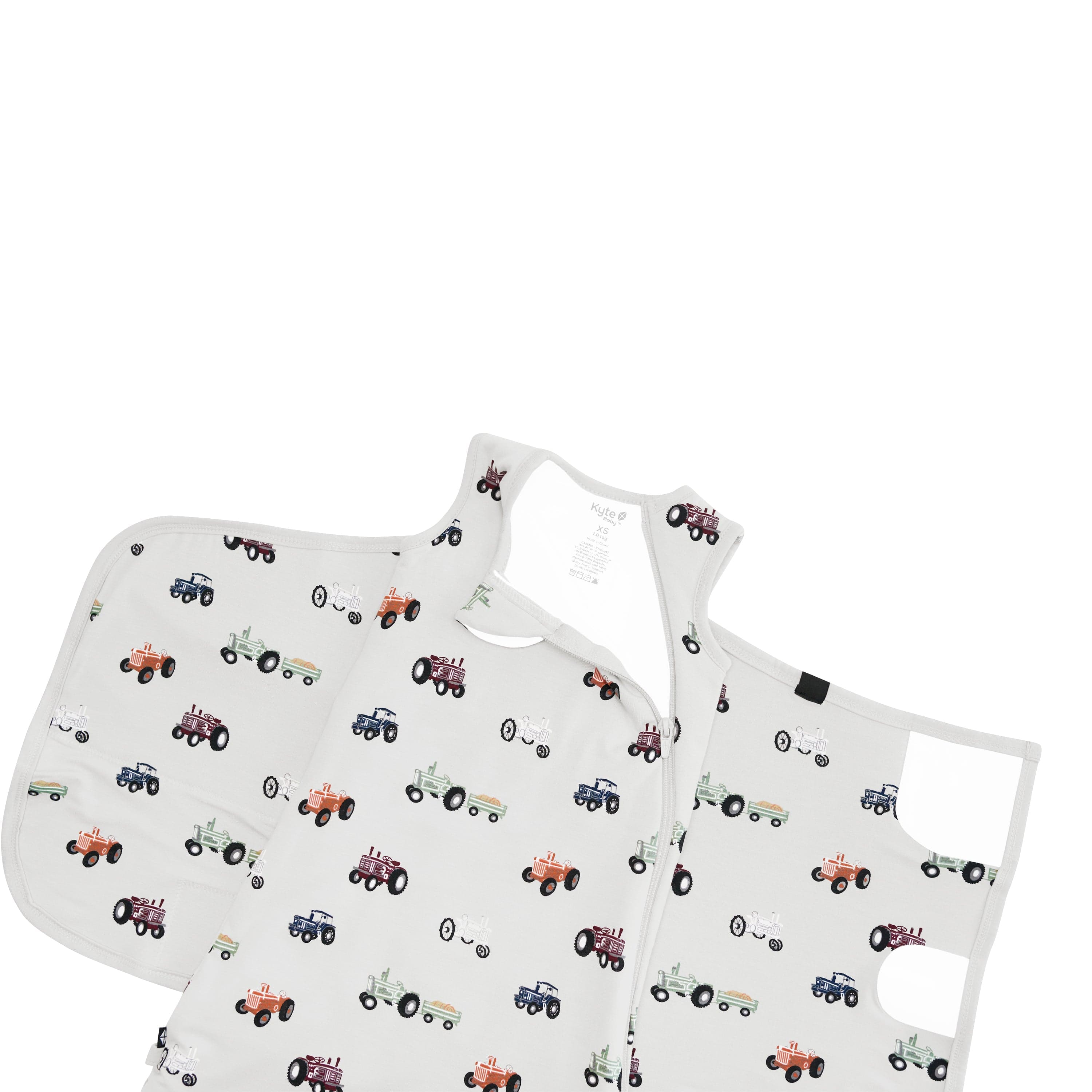 Close up on the Sleep Bag Swaddler in Tractor 1.0 shown unswaddled and top zipper unzipped