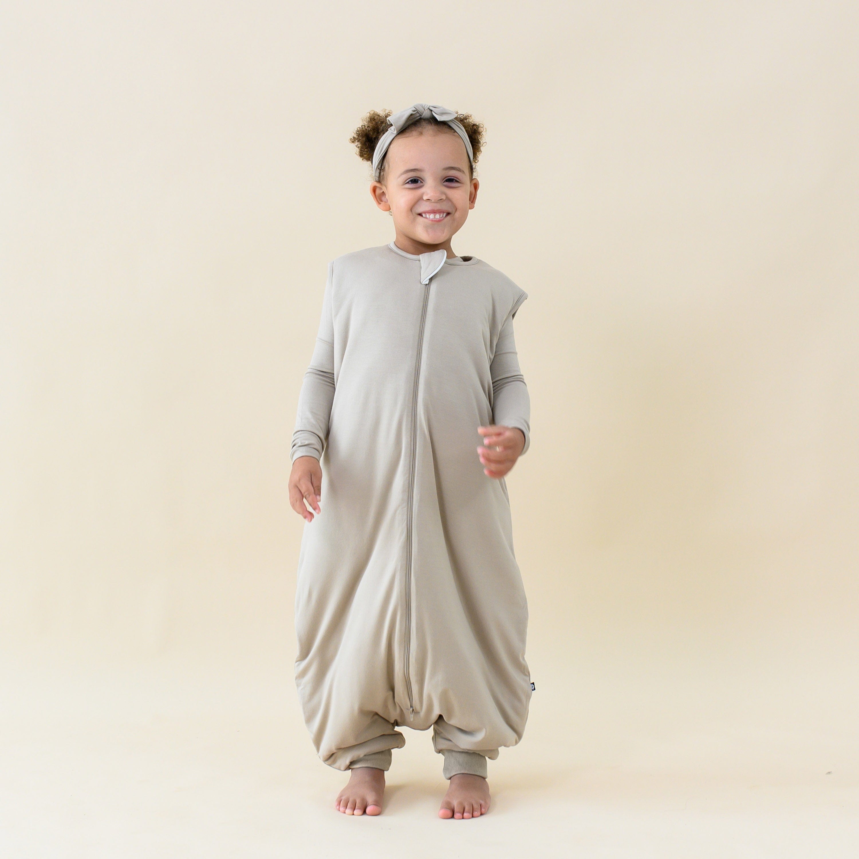 Girl wearing Sleep Bag Walker in Almond 2.5 with Matching PJs