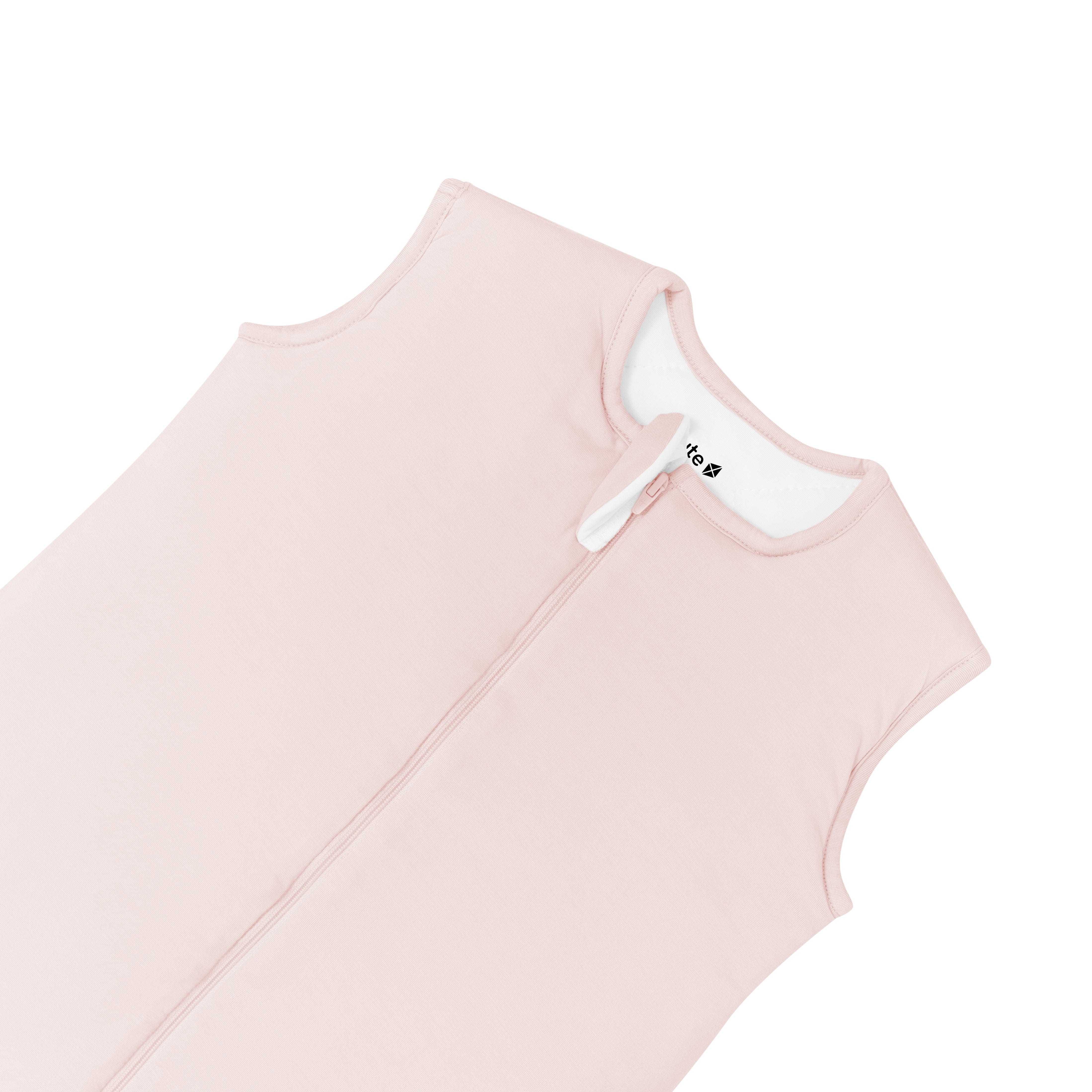 Close up of zipped up neckline and zipper garage on Kyte Baby Sleep Bag Walker in Blush 1.0