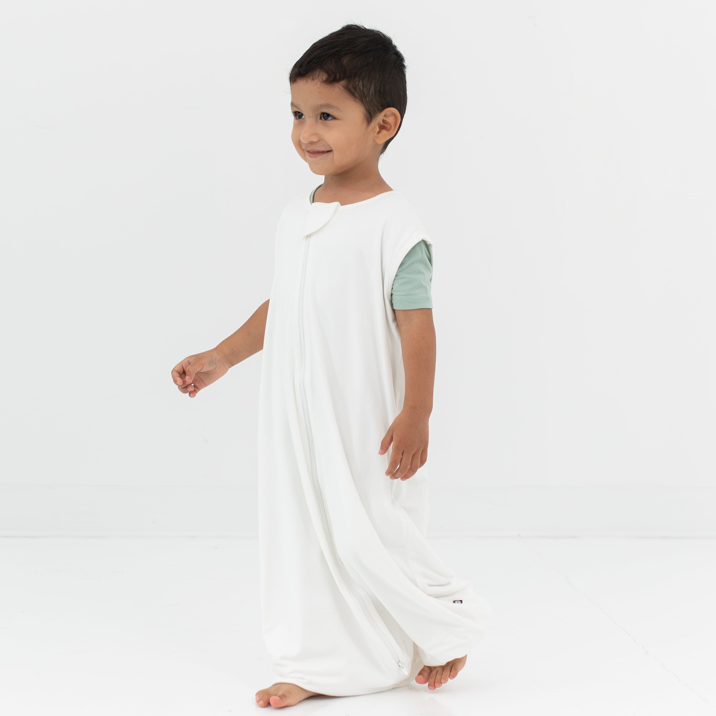 Child model walking wearing the Sleep Bag Walker in Cloud 0.5