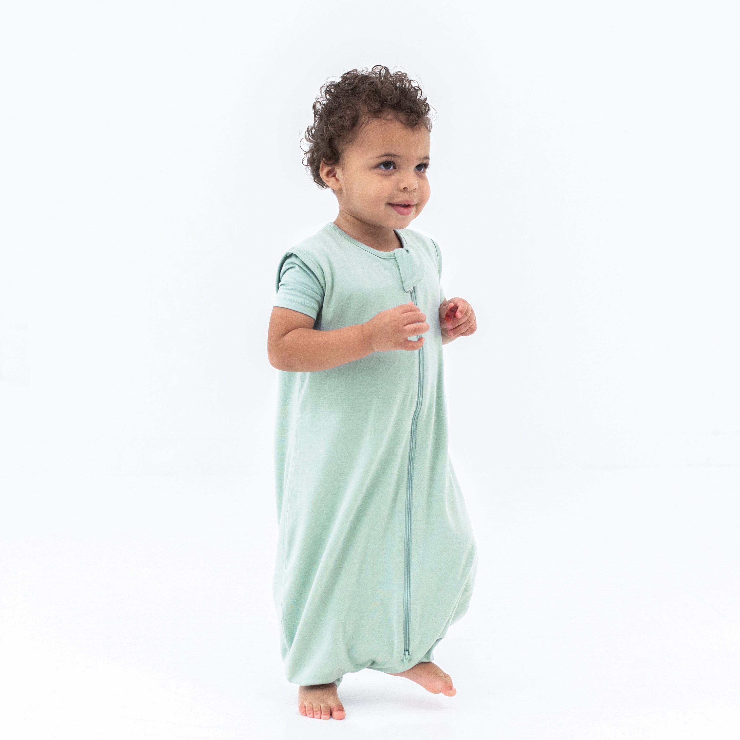 Young child wearing the Sleep Bag Walker in Sage 0.5