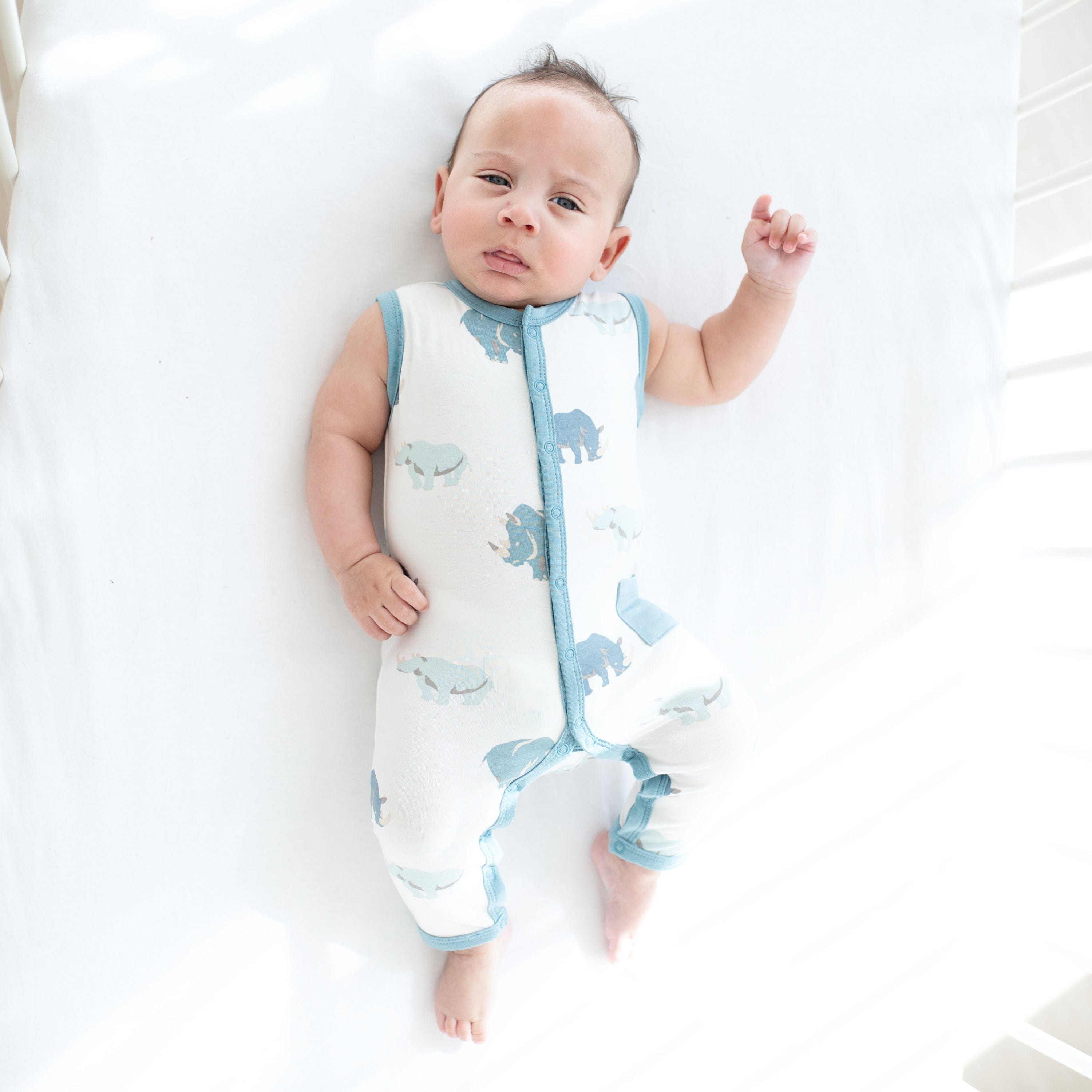 Infant wearing Kyte Baby Sleeveless capri Romper in Rhino