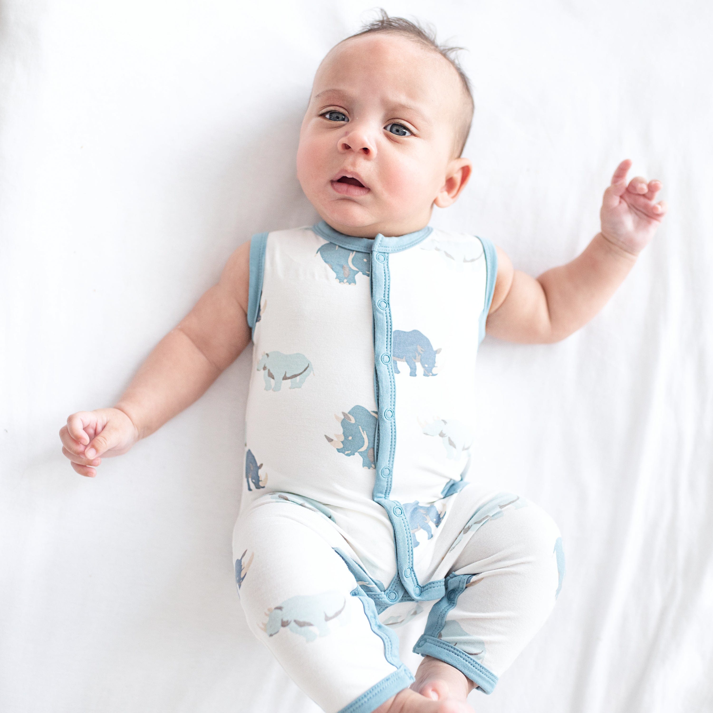Child wearing bamboo Kyte Baby Sleeveless Romper in Rhino