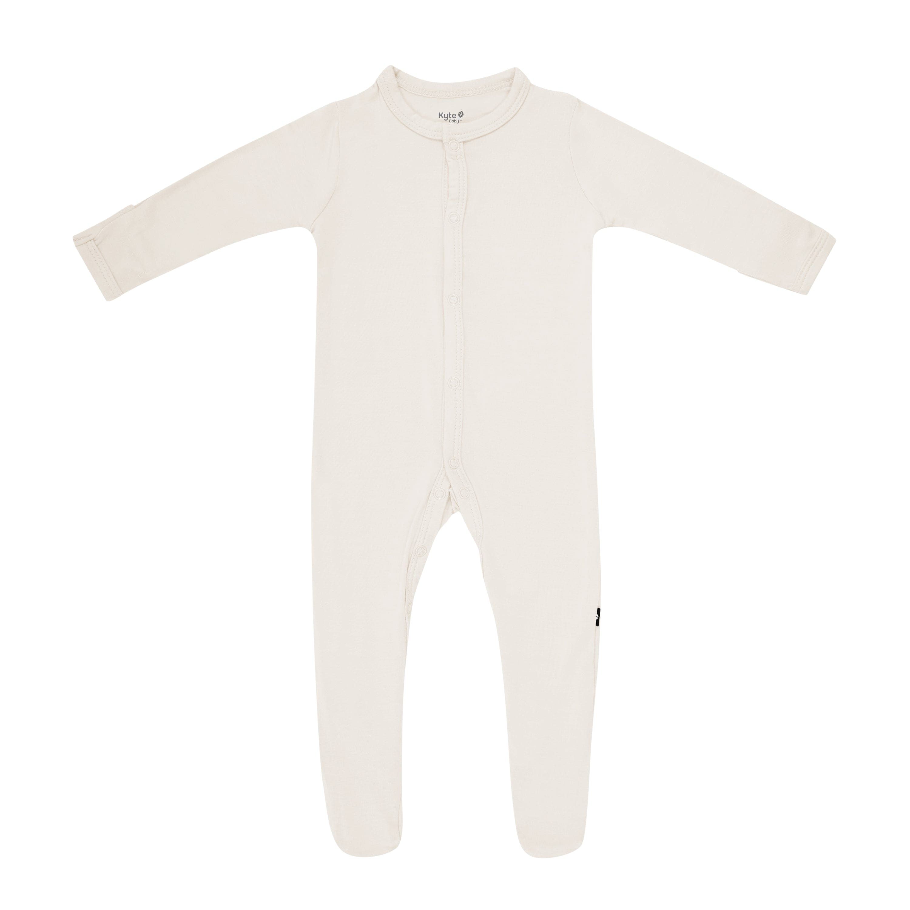 Flat lay of Kyte Baby footie in Oat