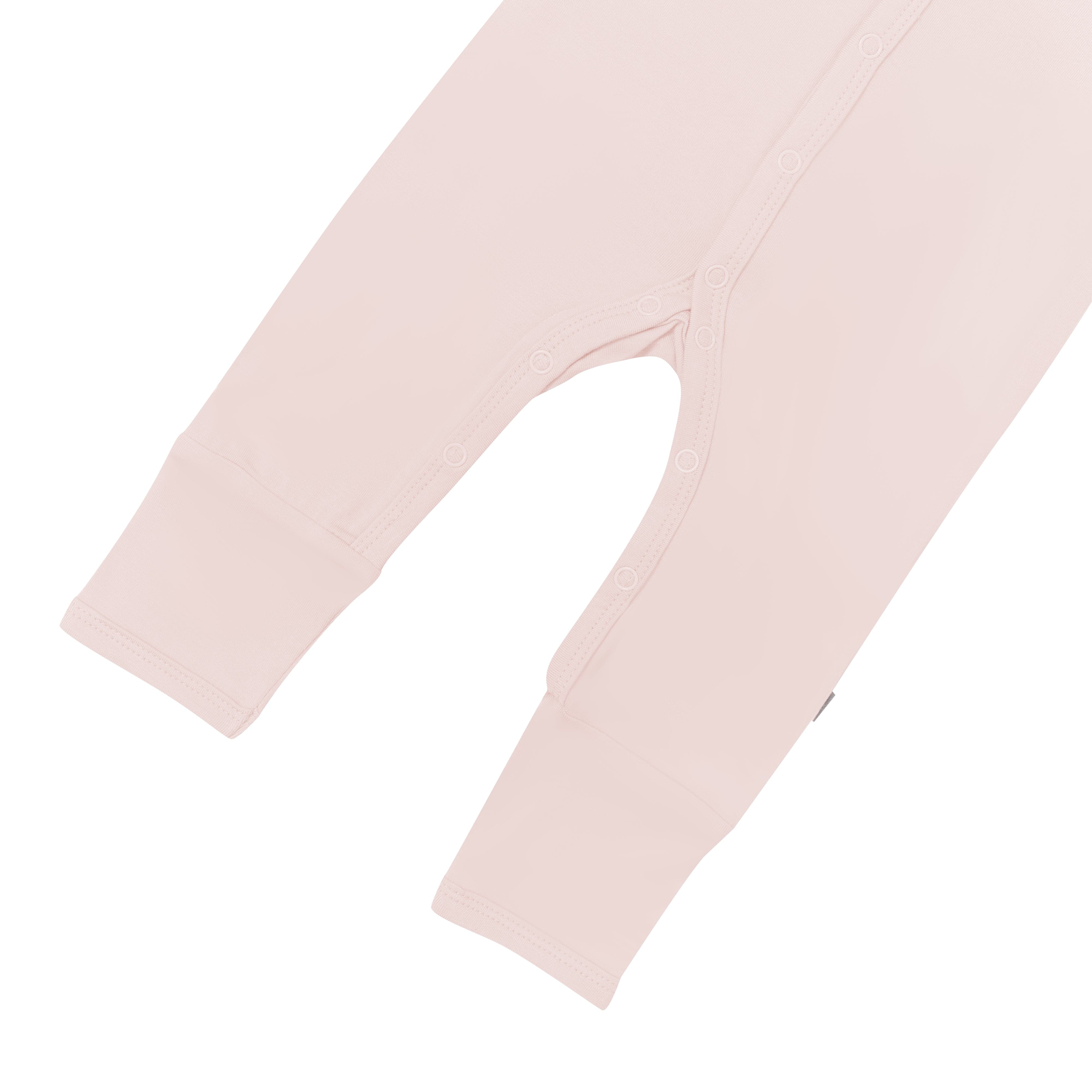 Close up of snaps and legs on Kyte Baby Romper in Blush