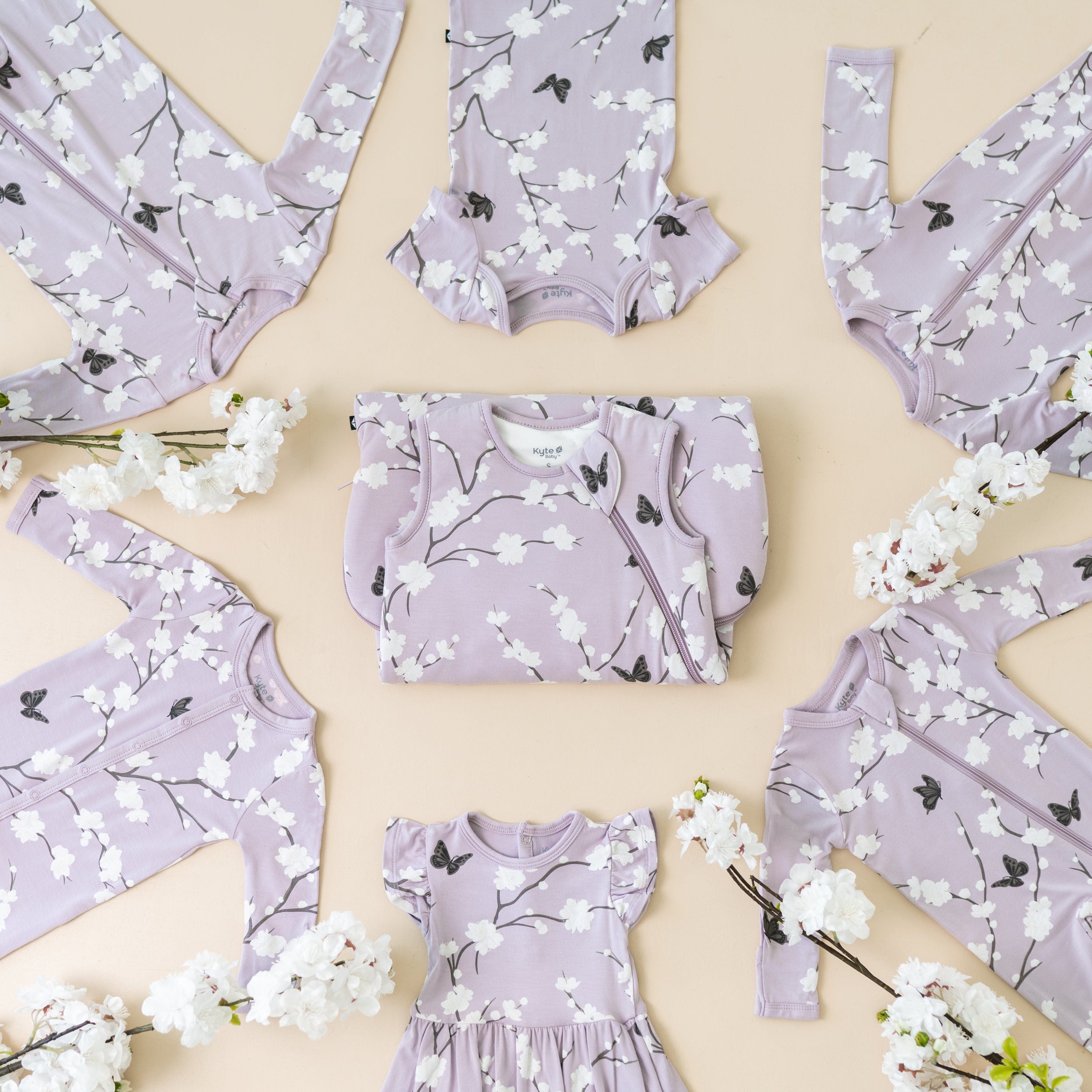 Kyte Baby selection of bamboo baby clothing and sleep bags in Cherry Blossom