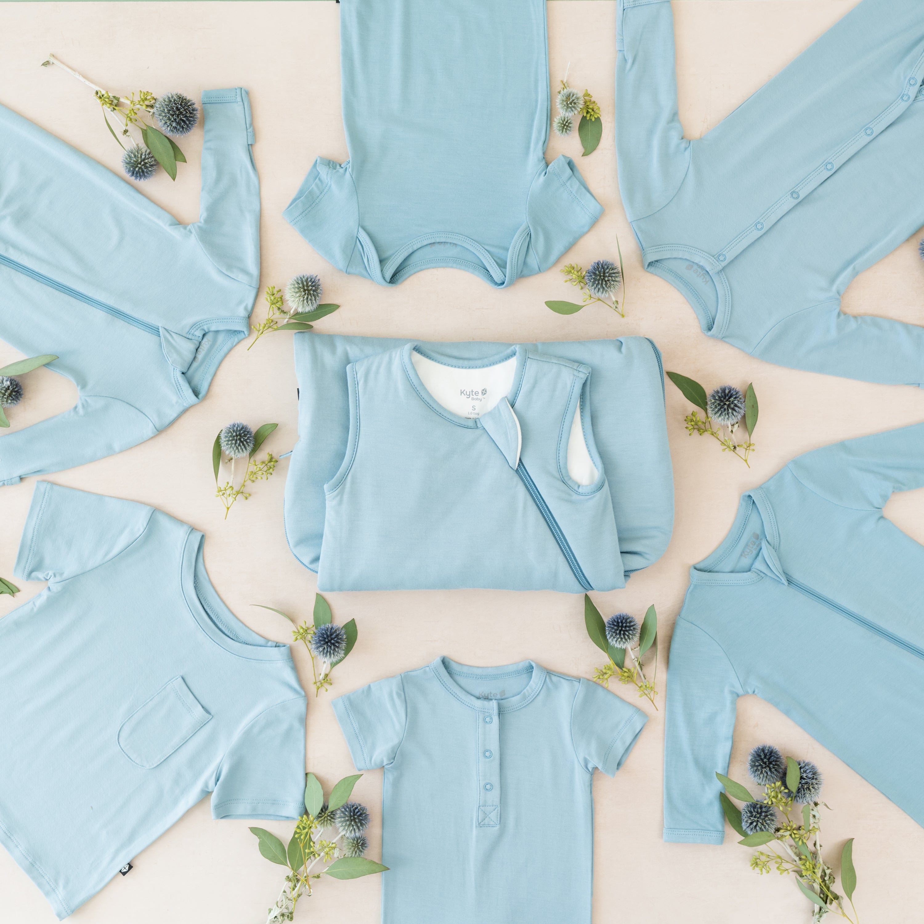 Kyte Baby selection of bamboo baby clothing and sleep bags in Dusty Blue