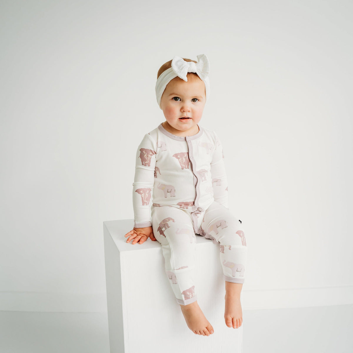 Toddler wearing Kyte Baby Romper in Elephant