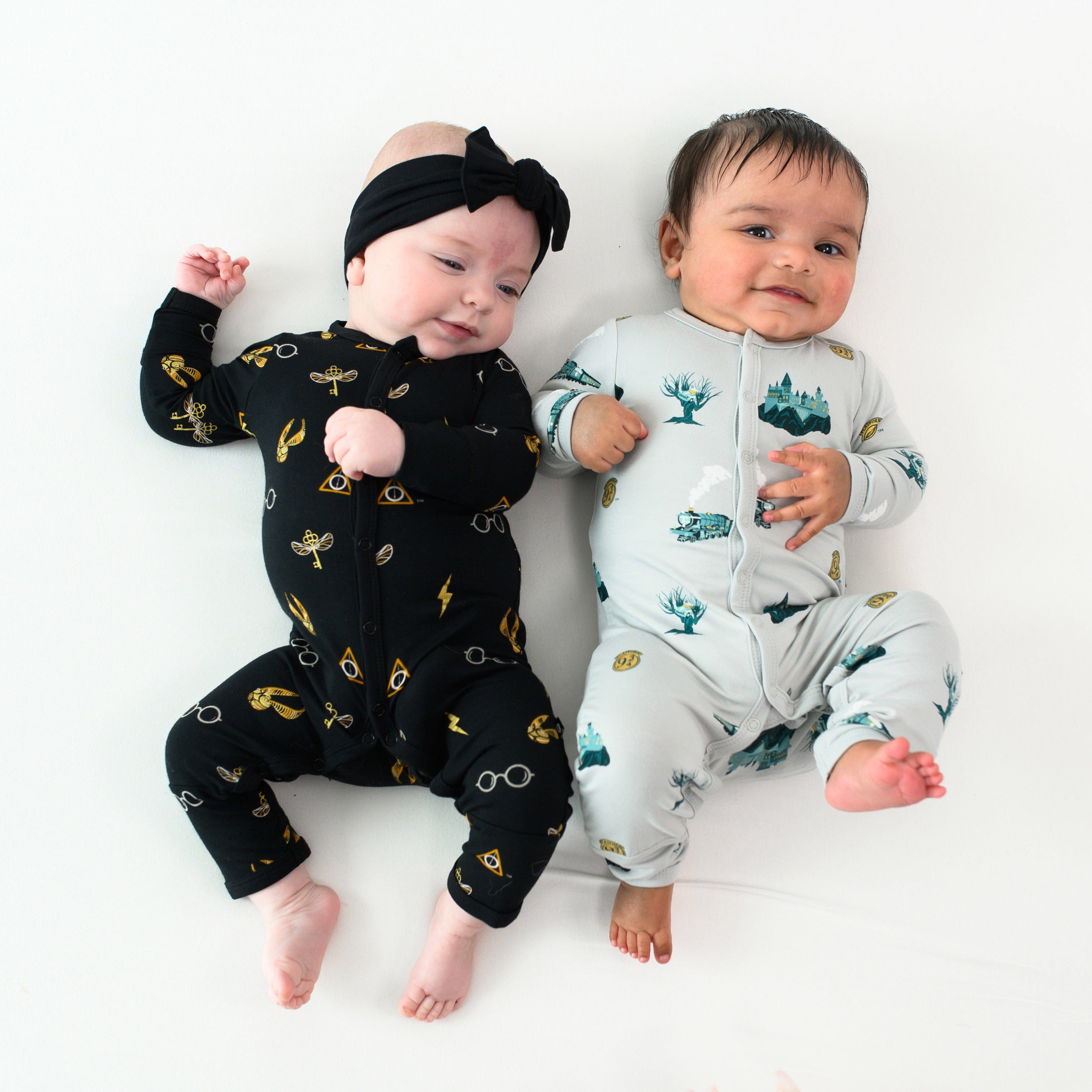 Children wearing Kyte Baby Snap Rompers in Harry Potter patterns
