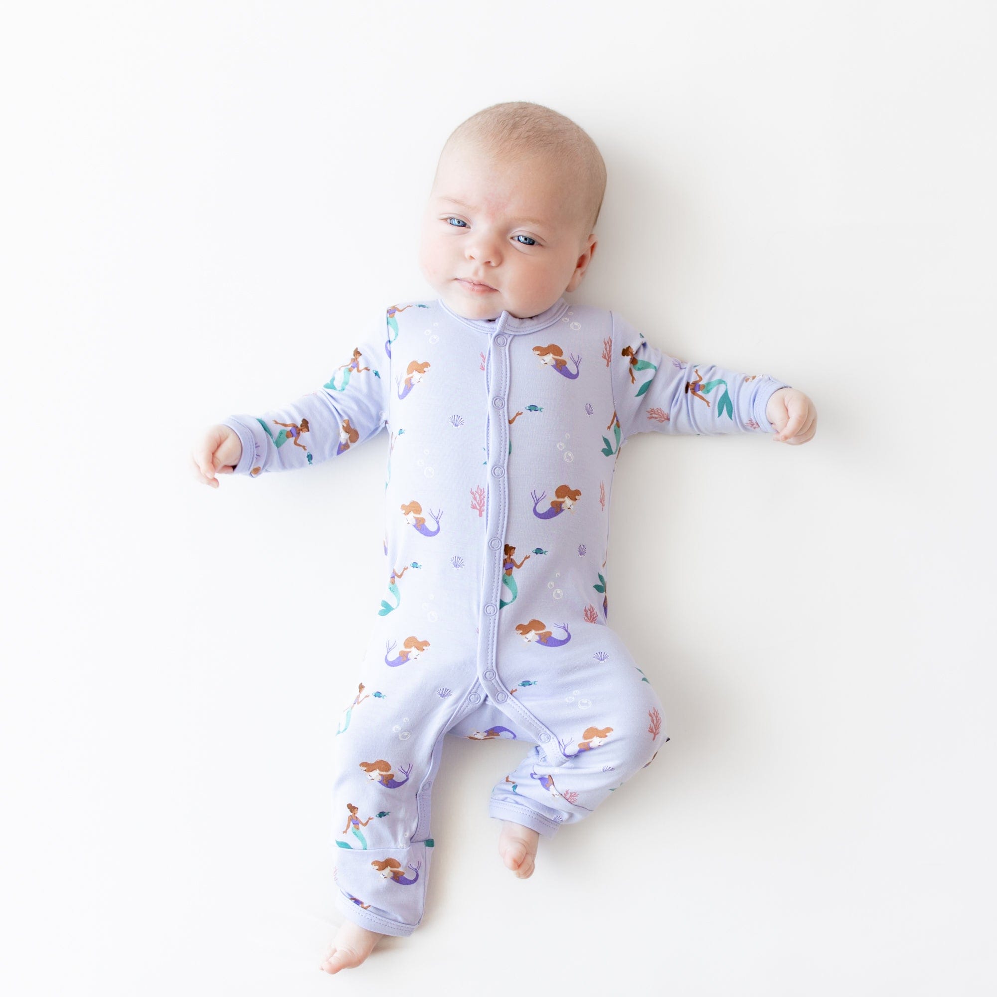 Infant wearing Kyte Baby Romper in Mermaid