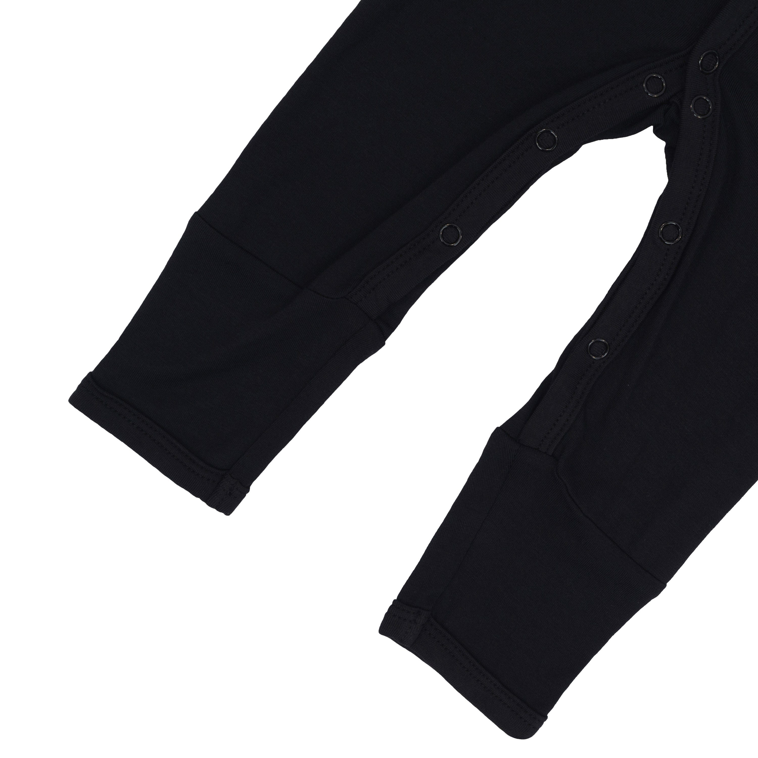 Close up of snaps on legs of Kyte Baby Romper in Midnight