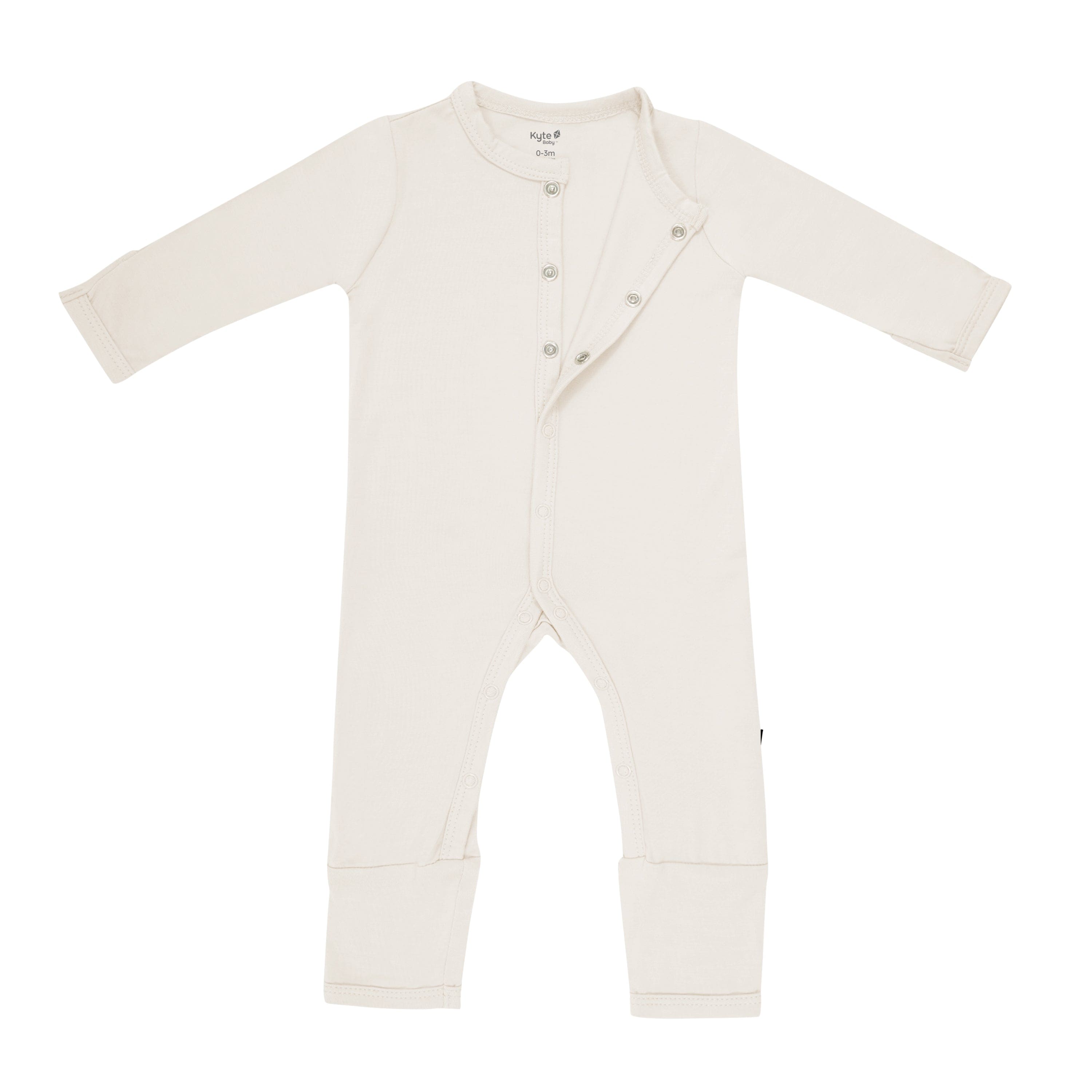 Kyte Baby Snap Romper in Oat unsnapped from the top
