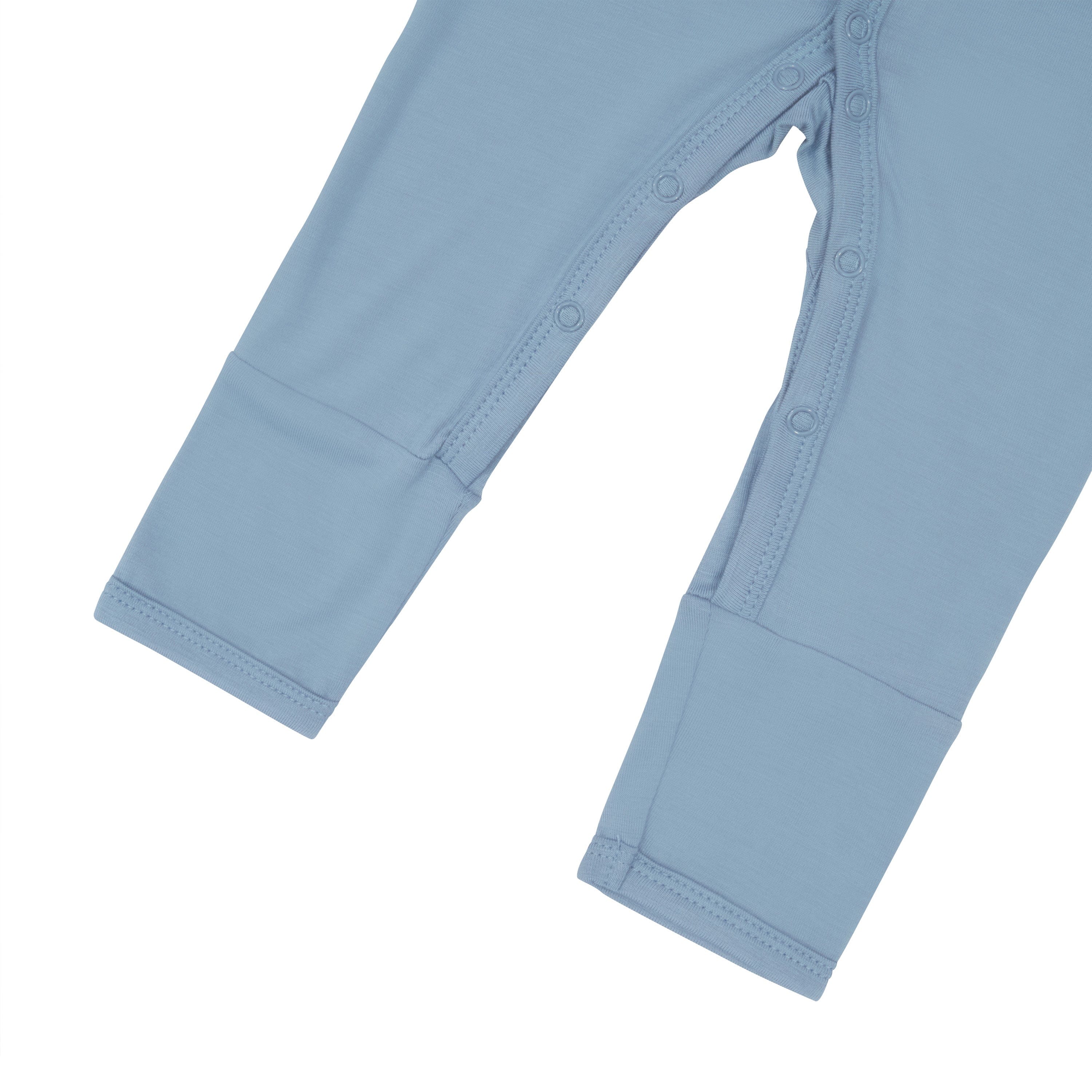Close up of snaps on legs of Kyte Baby Romper in Slate