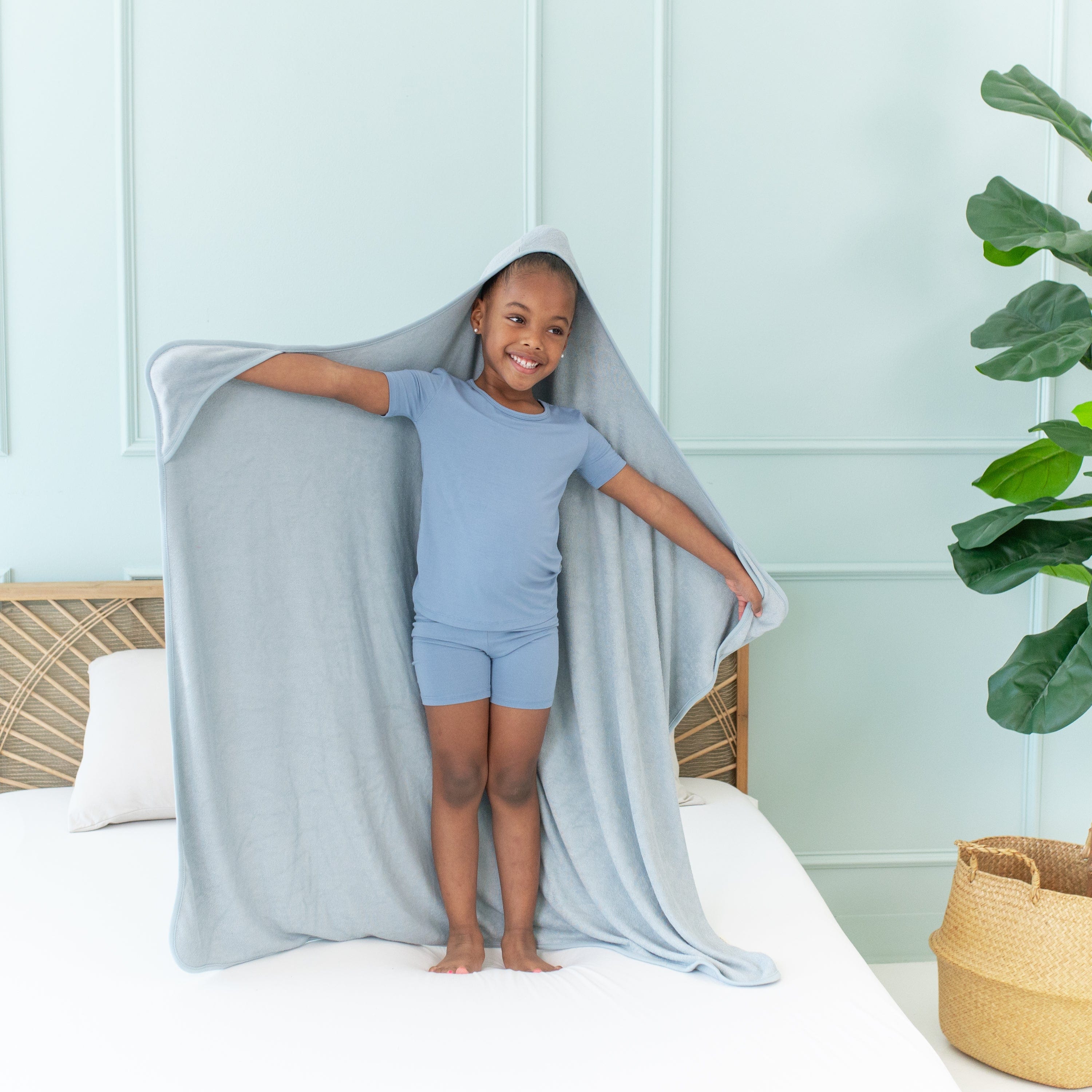 Child with Kyte Baby Toddler Hooded bamboo terry Bath Towel in Fog gray