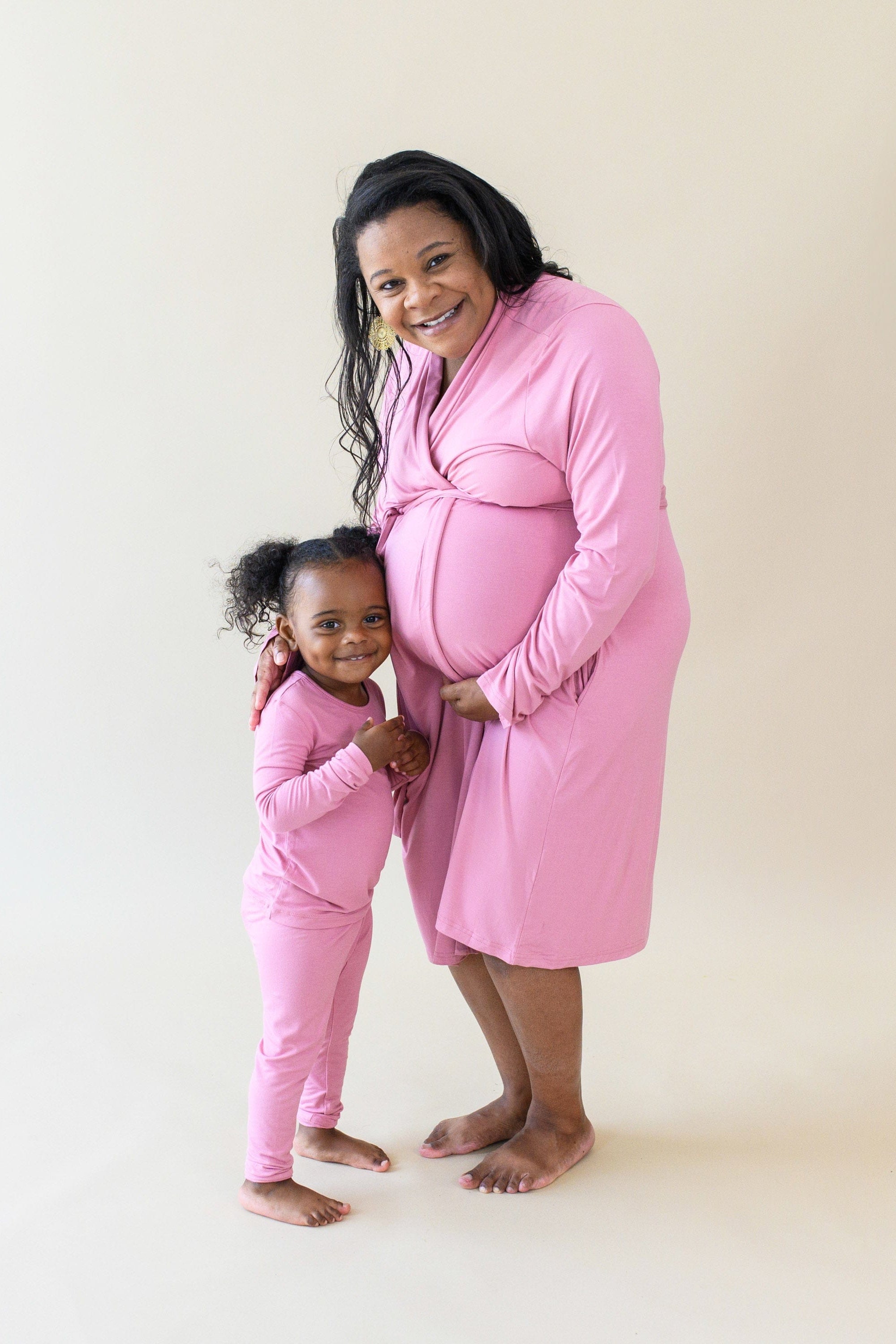 Toddler wearing Kyte Baby bamboo Long Sleeve Pajamas in Apple Blossom with mom in matching robe