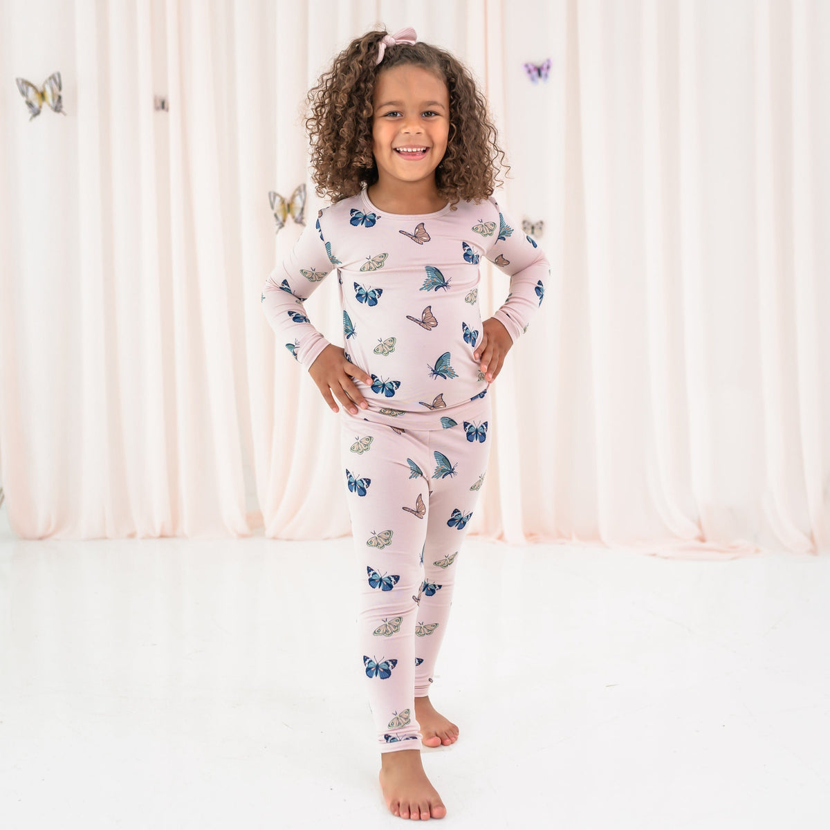 Toddler wearing Long Sleeve Pajamas in Blush Butterfly