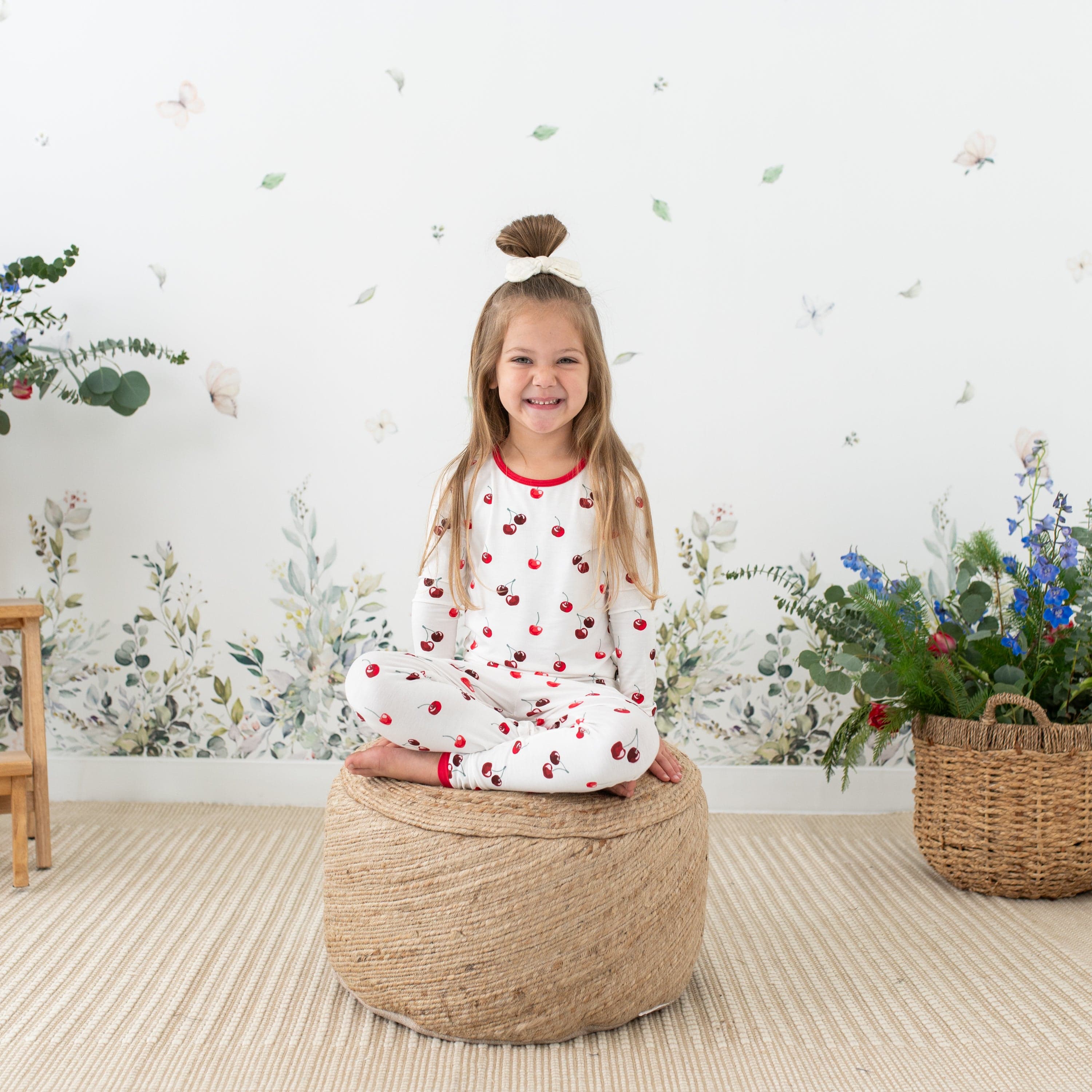 Toddler wearing Kyte Baby bamboo Long Sleeve Pajamas in Cherry