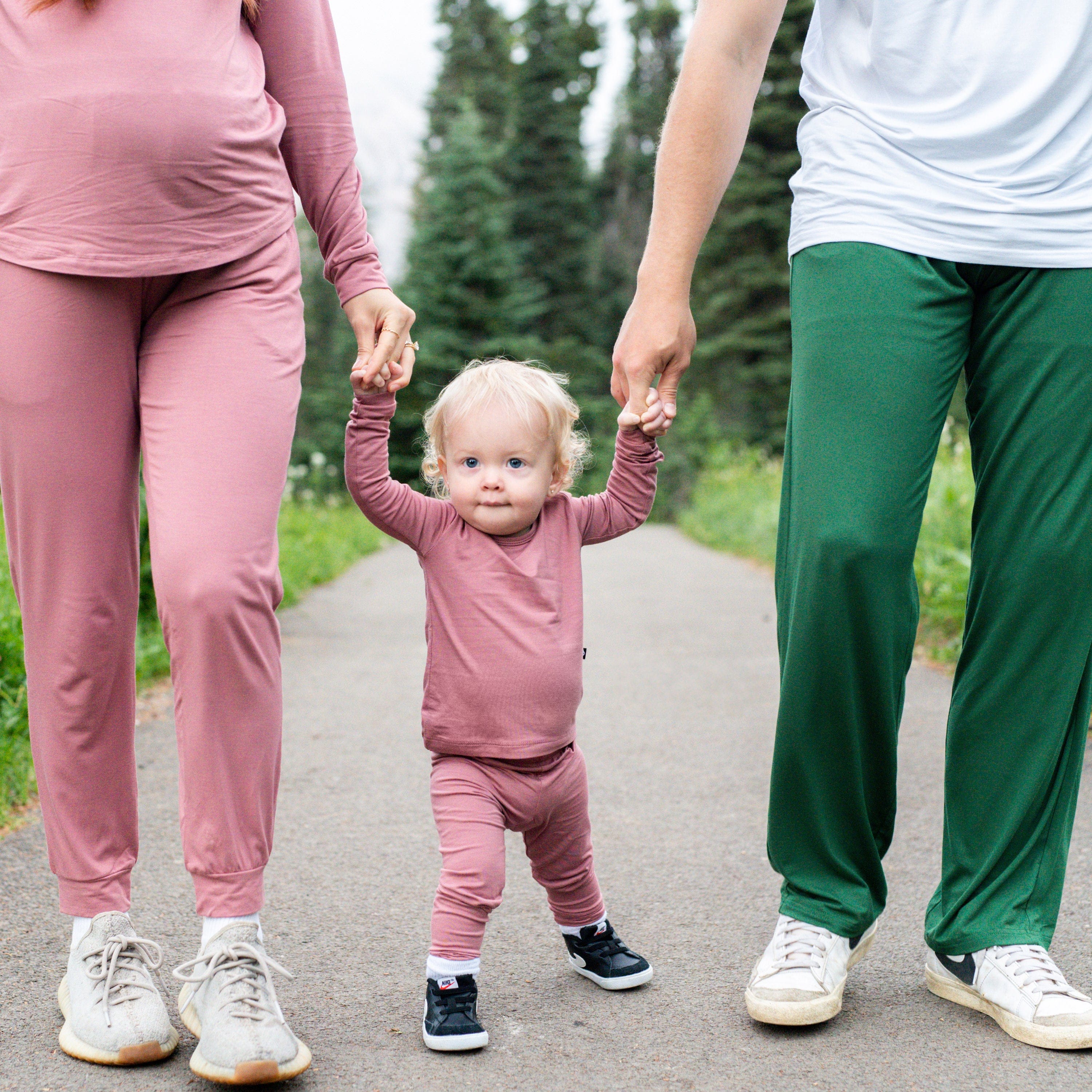 Family wearing coordinating Kyte Baby pajamas