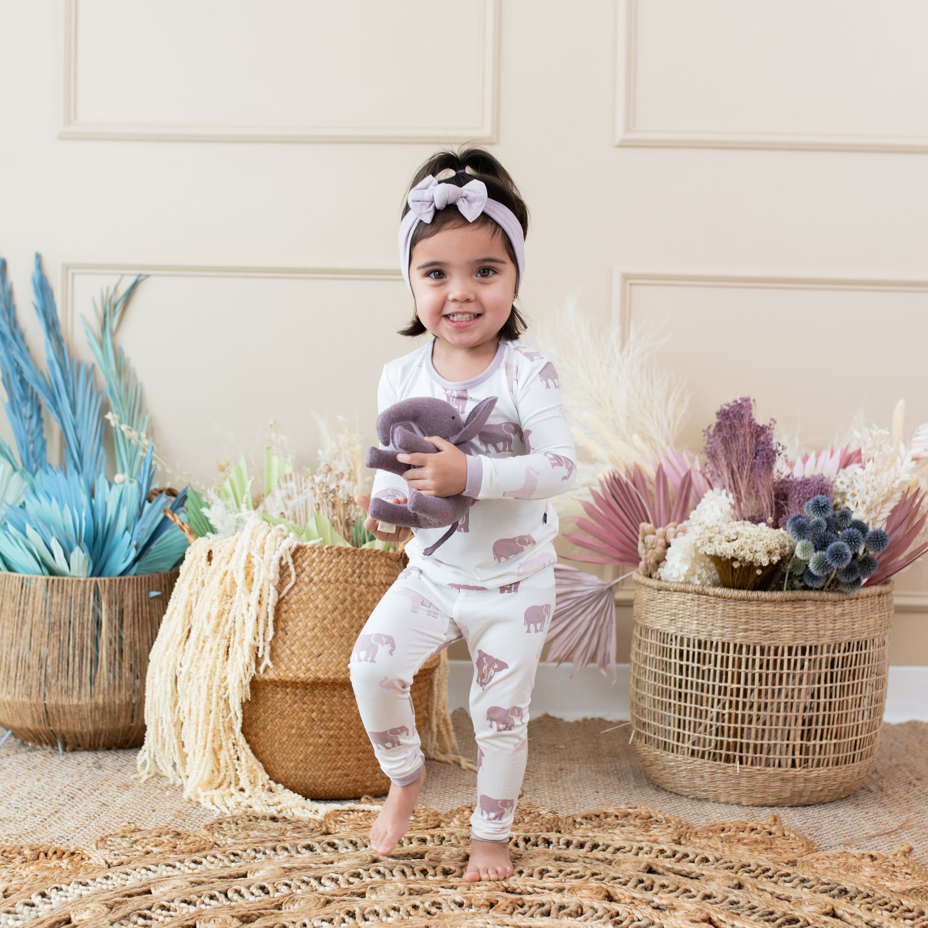 Child wearing Kyte Baby Long Sleeve Pajamas in Elephant