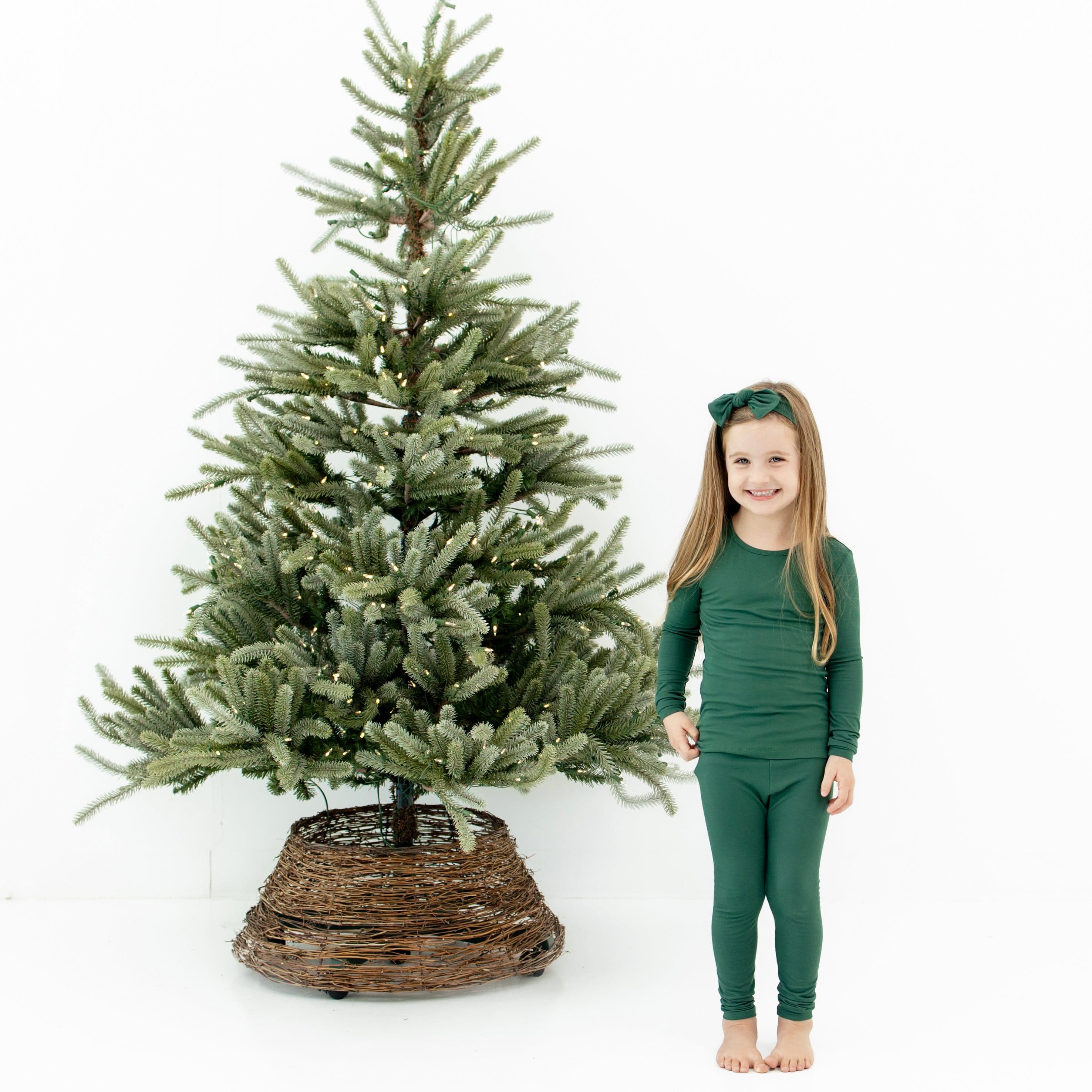 Girl wearing Toddler Long Sleeve Christmas Pajamas in Evergreen