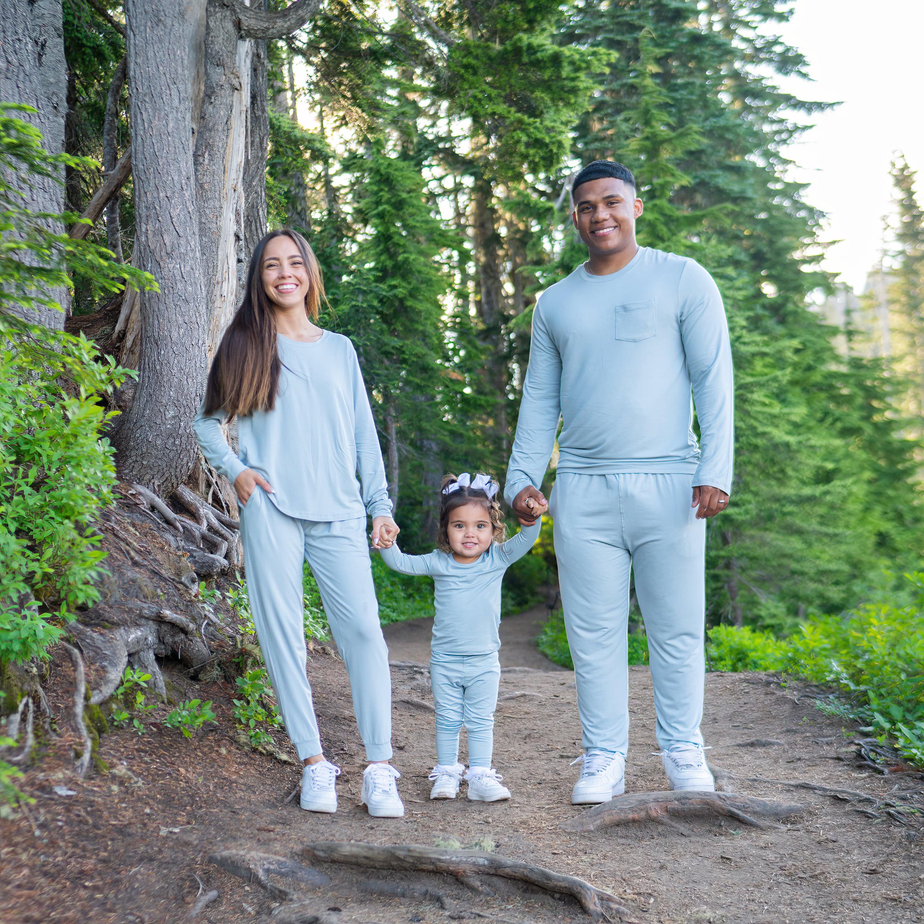 Family wearing matching Long Sleeve Pajamas in Fog Light Blue