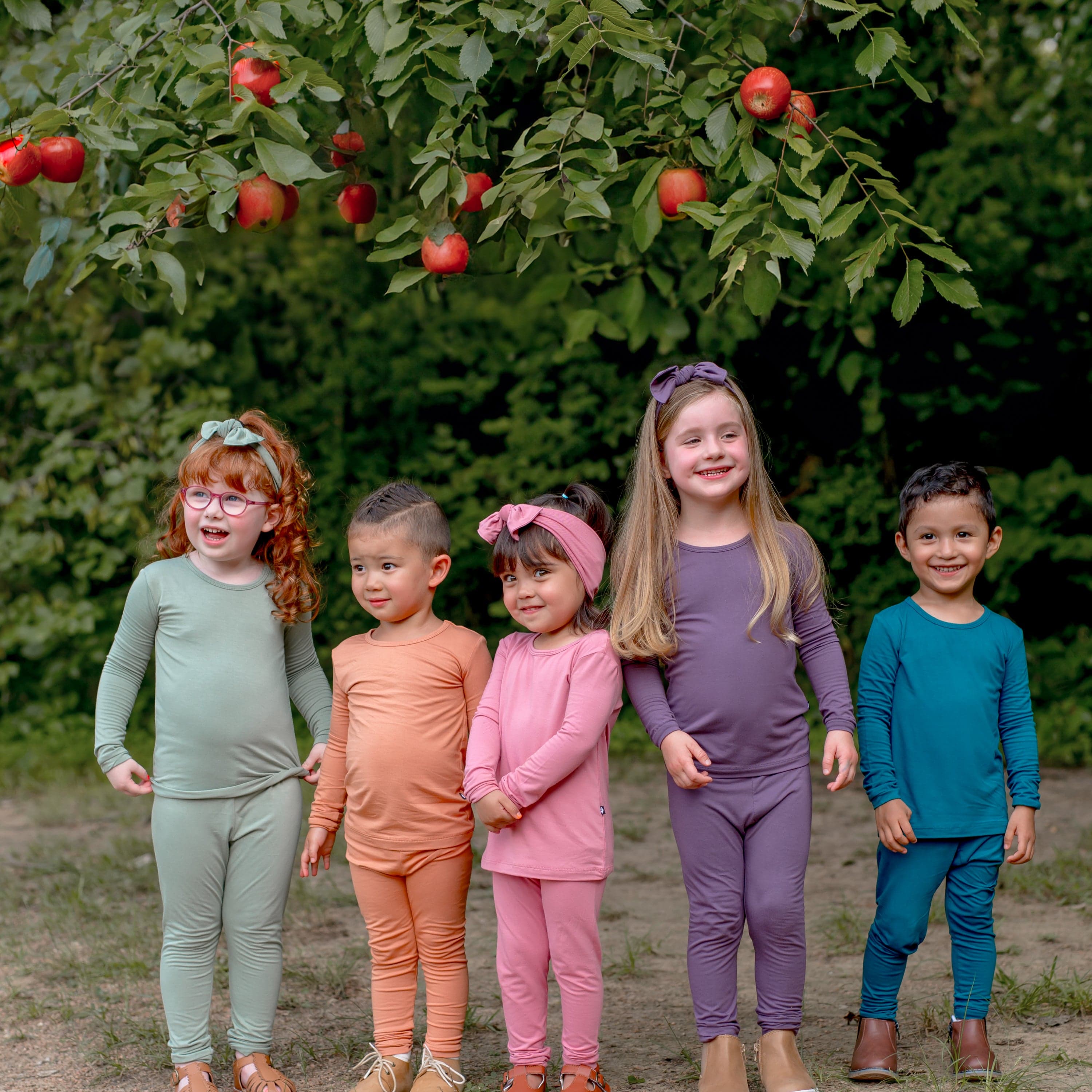 Kids wearing Kyte Baby long sleeve pajamas