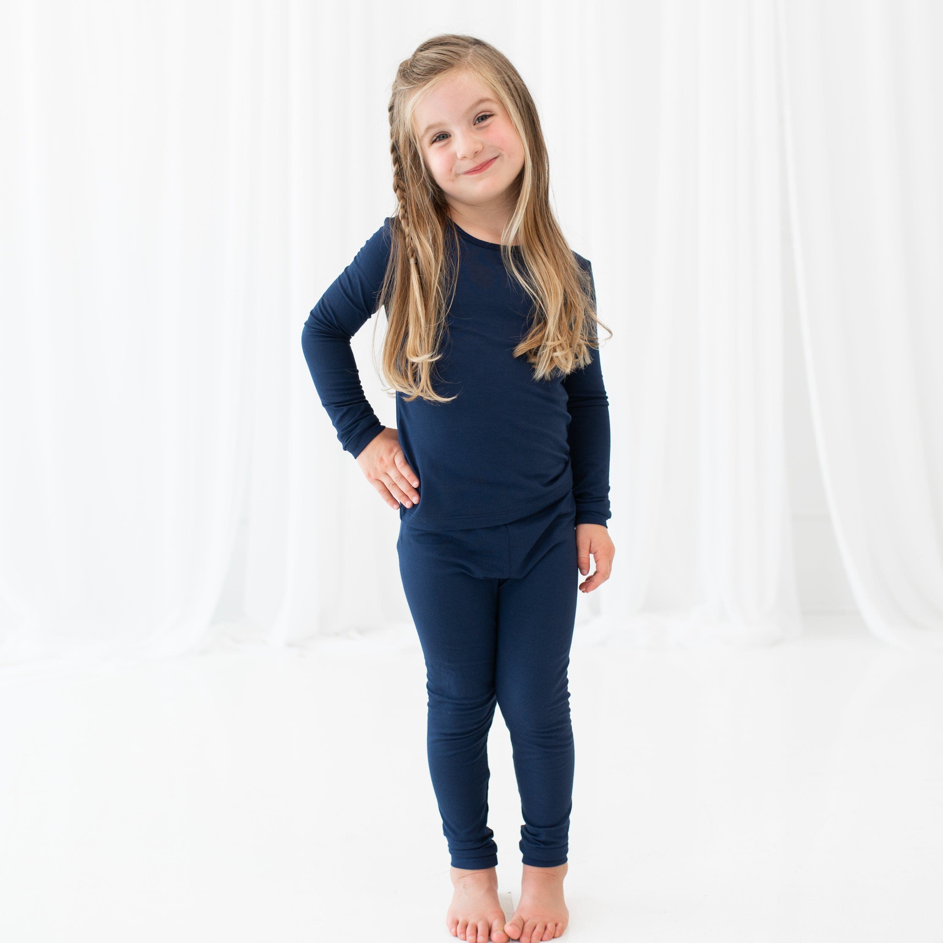 Smiling toddler wearing Long Sleeve Pajama Set in Navy