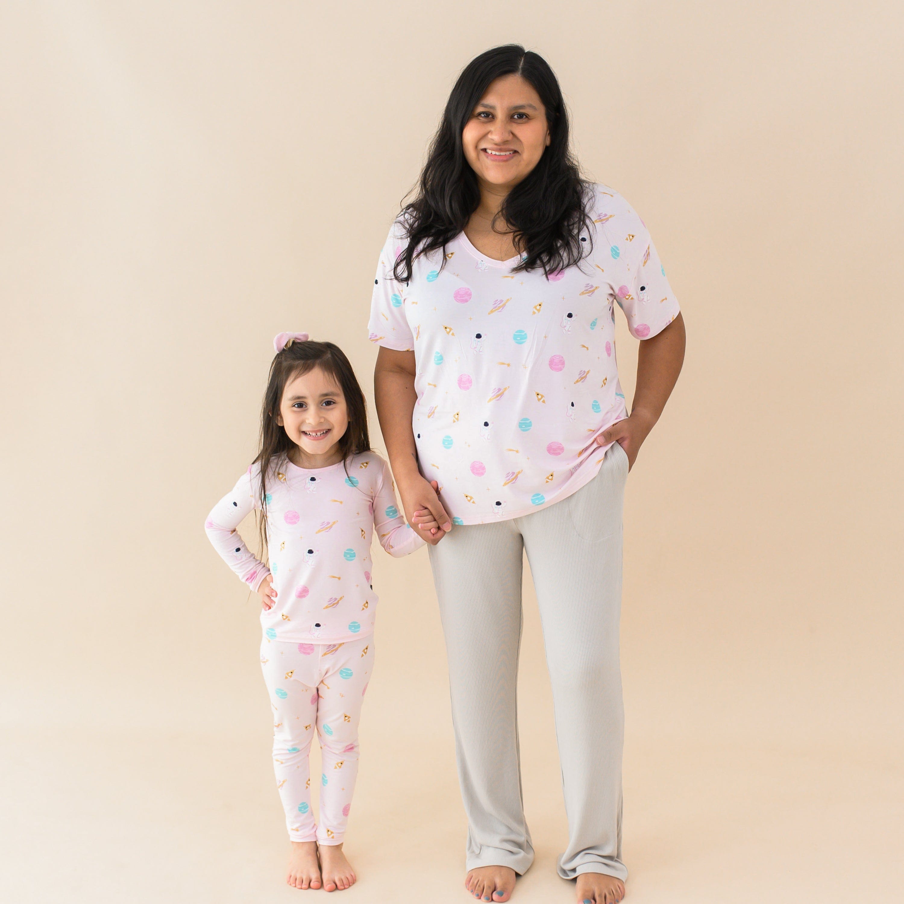 Family wearing matching mommy and me outfits in Sakura Space