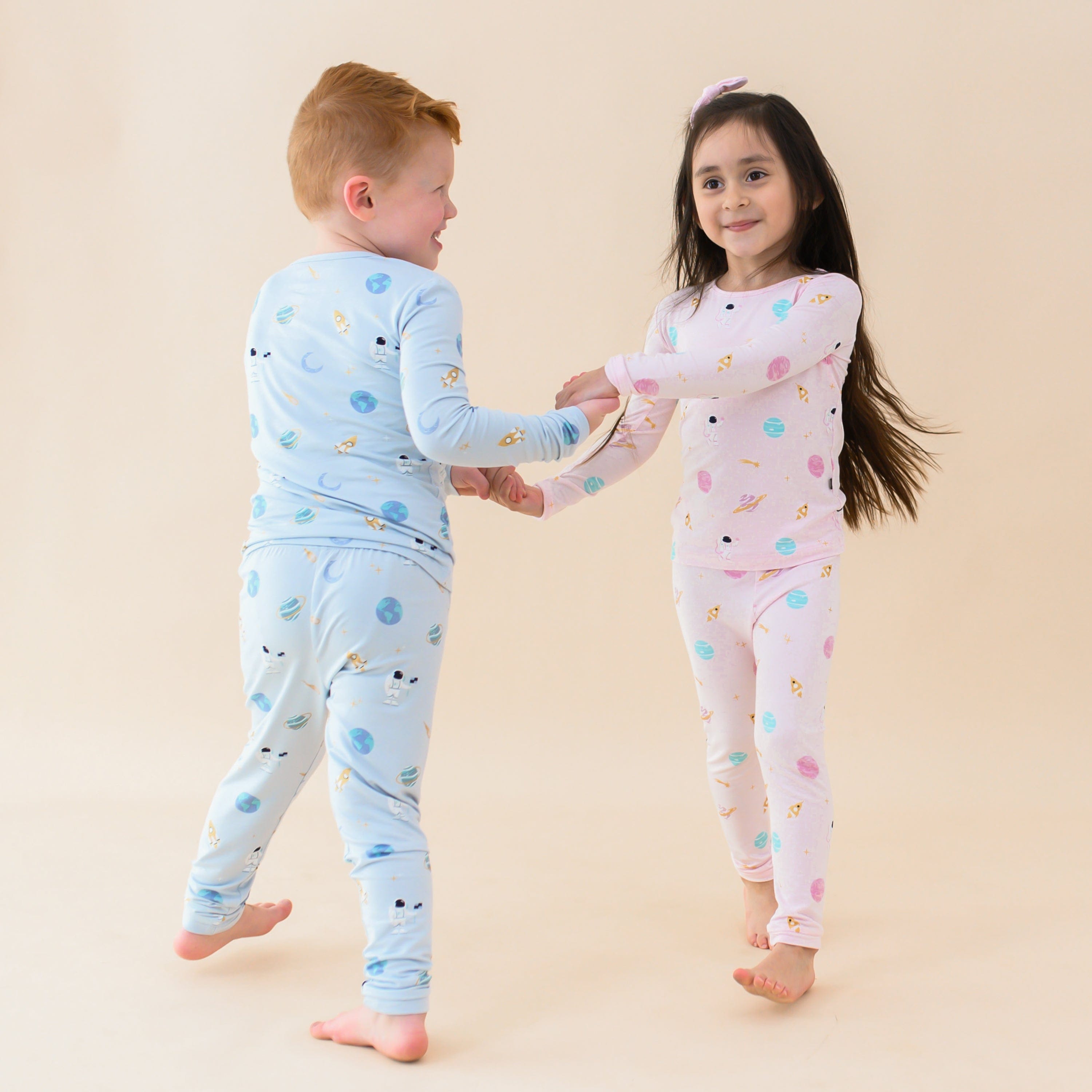 Kids wearing Toddler Long Sleeve Pajamas in Ice and Sakura Space