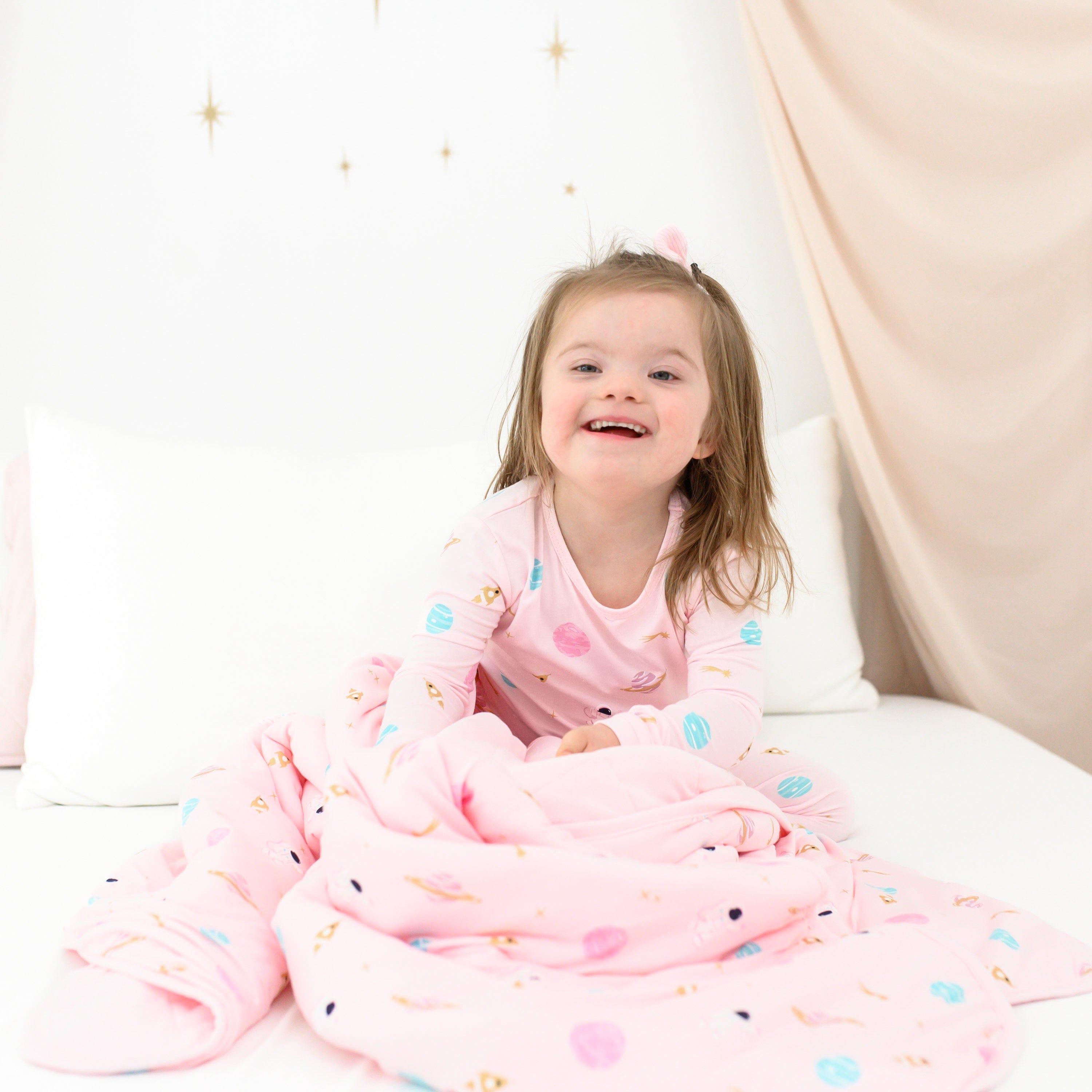 Toddler wearing Long Sleeve pink kids Pajamas in Sakura Space