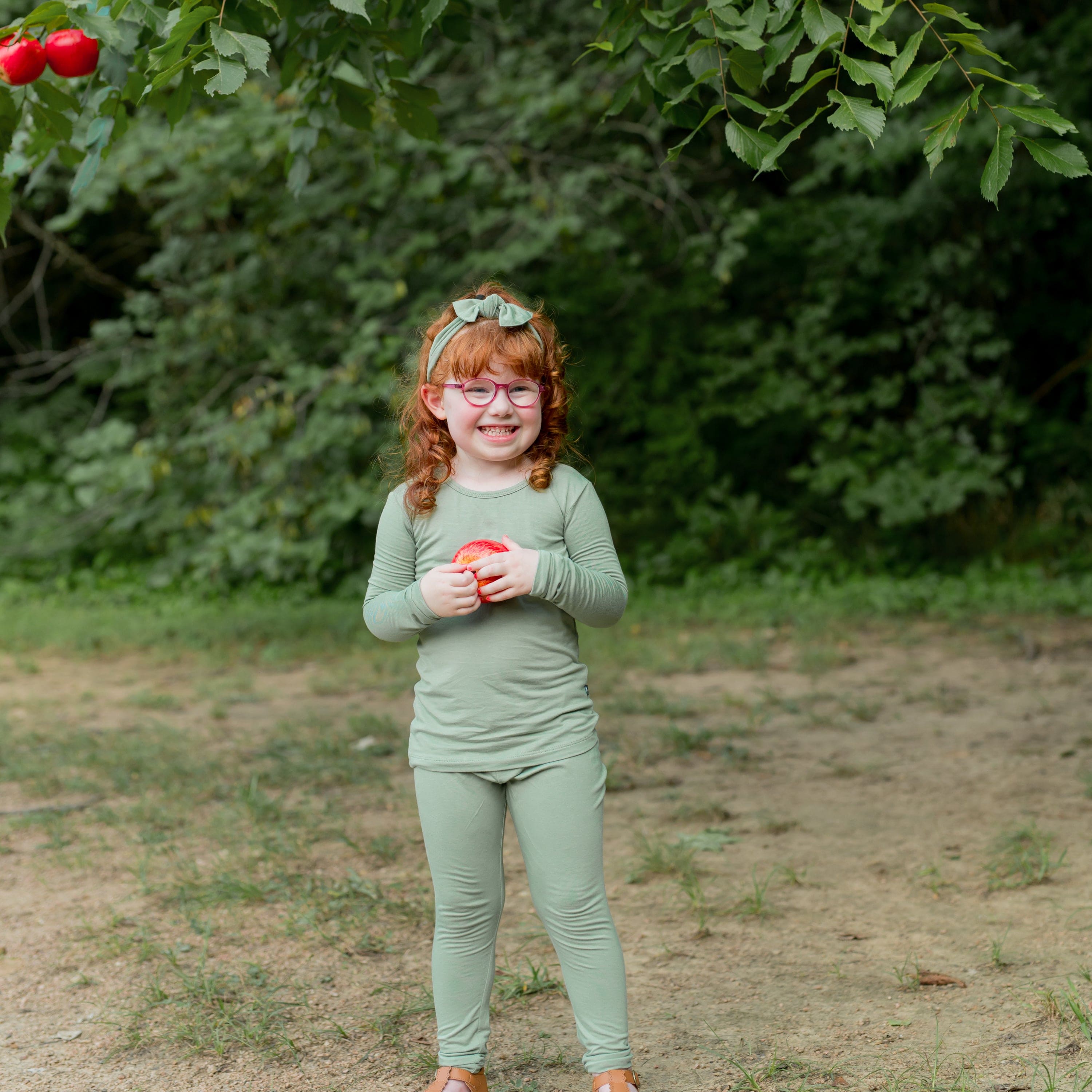 Child wearing Long Sleeve bamboo Pajamas in green Thyme
