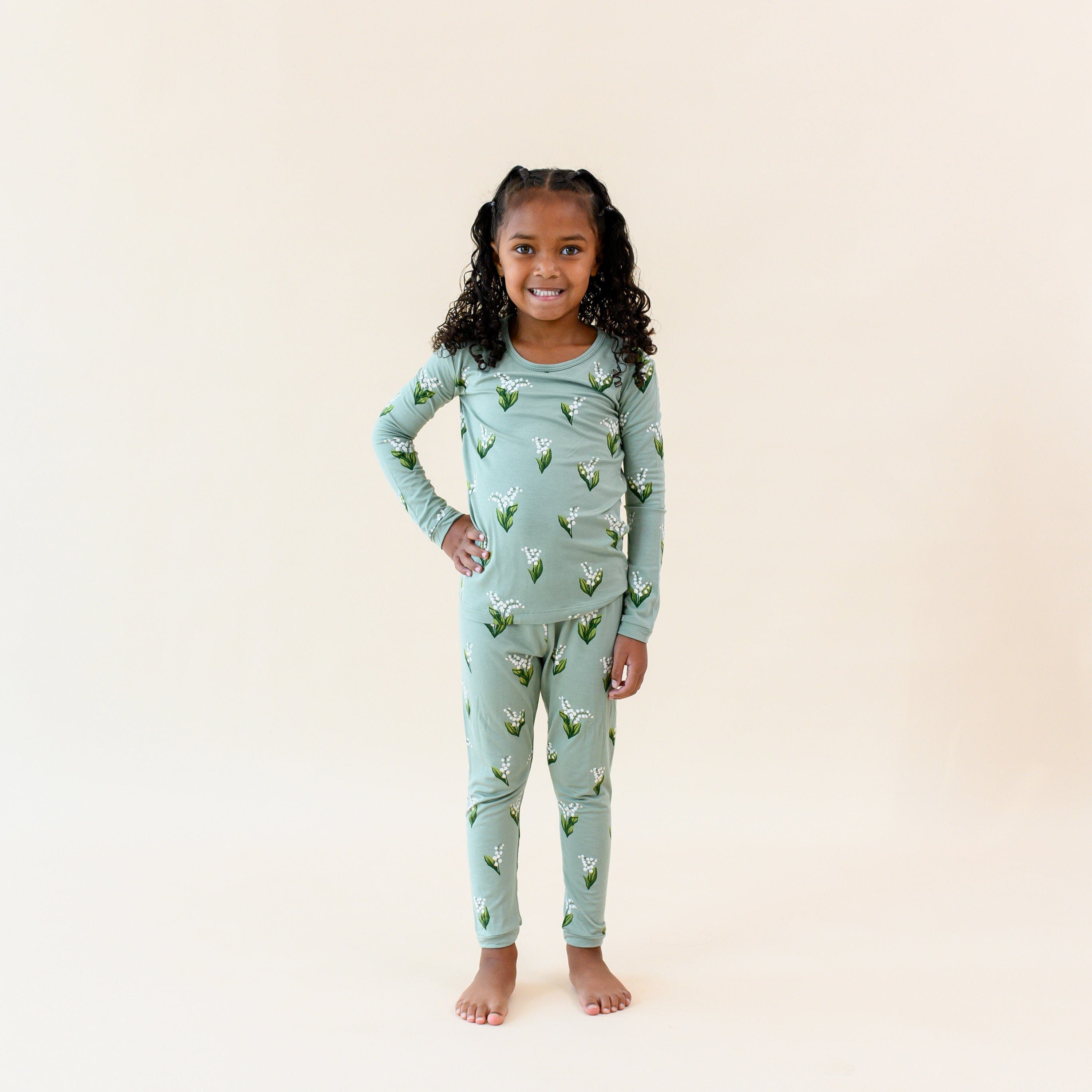 Girl wearing Long Sleeve Pajamas in Thyme Lily