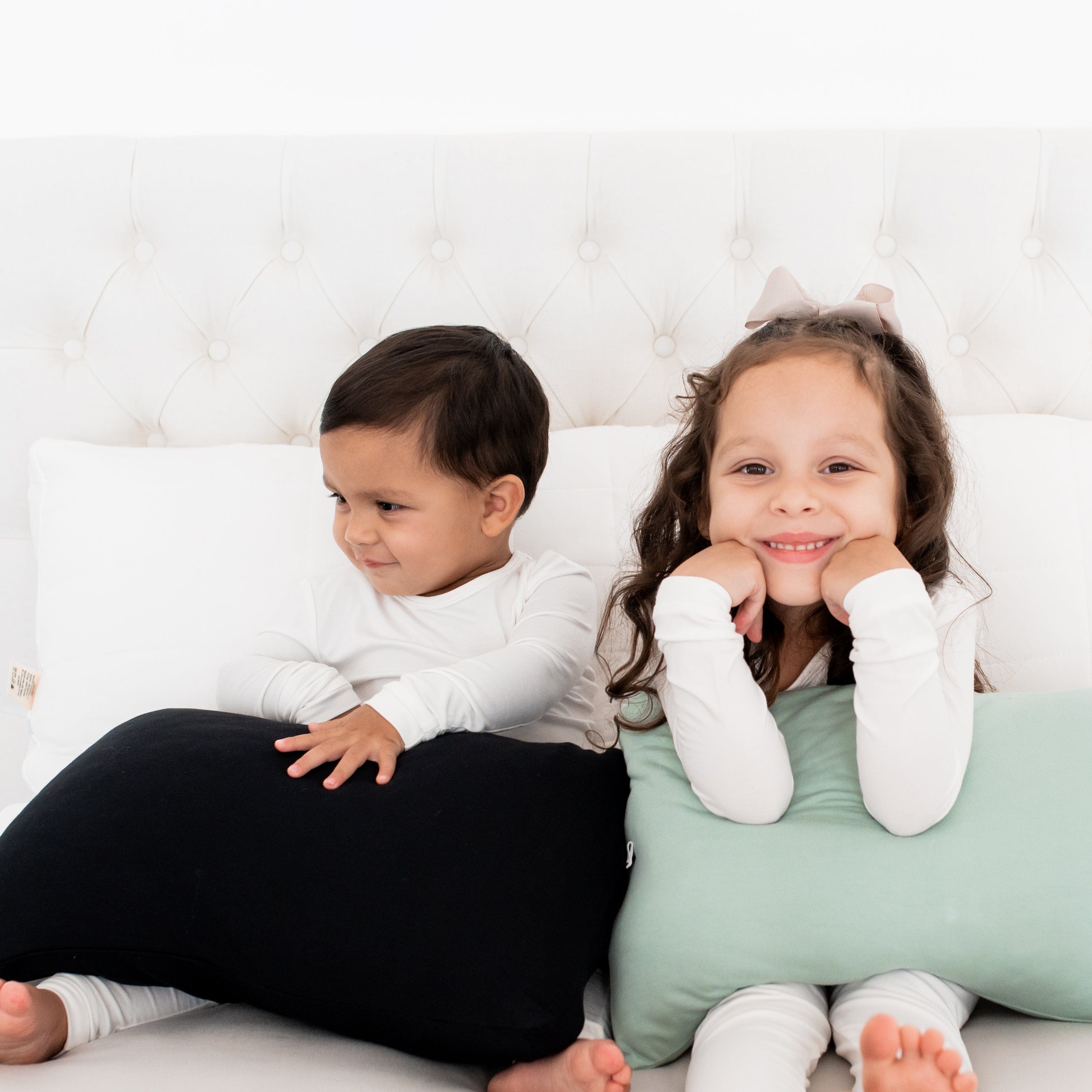 Kids holding Kyte Baby Toddler Pillowcases with Envelope Closure