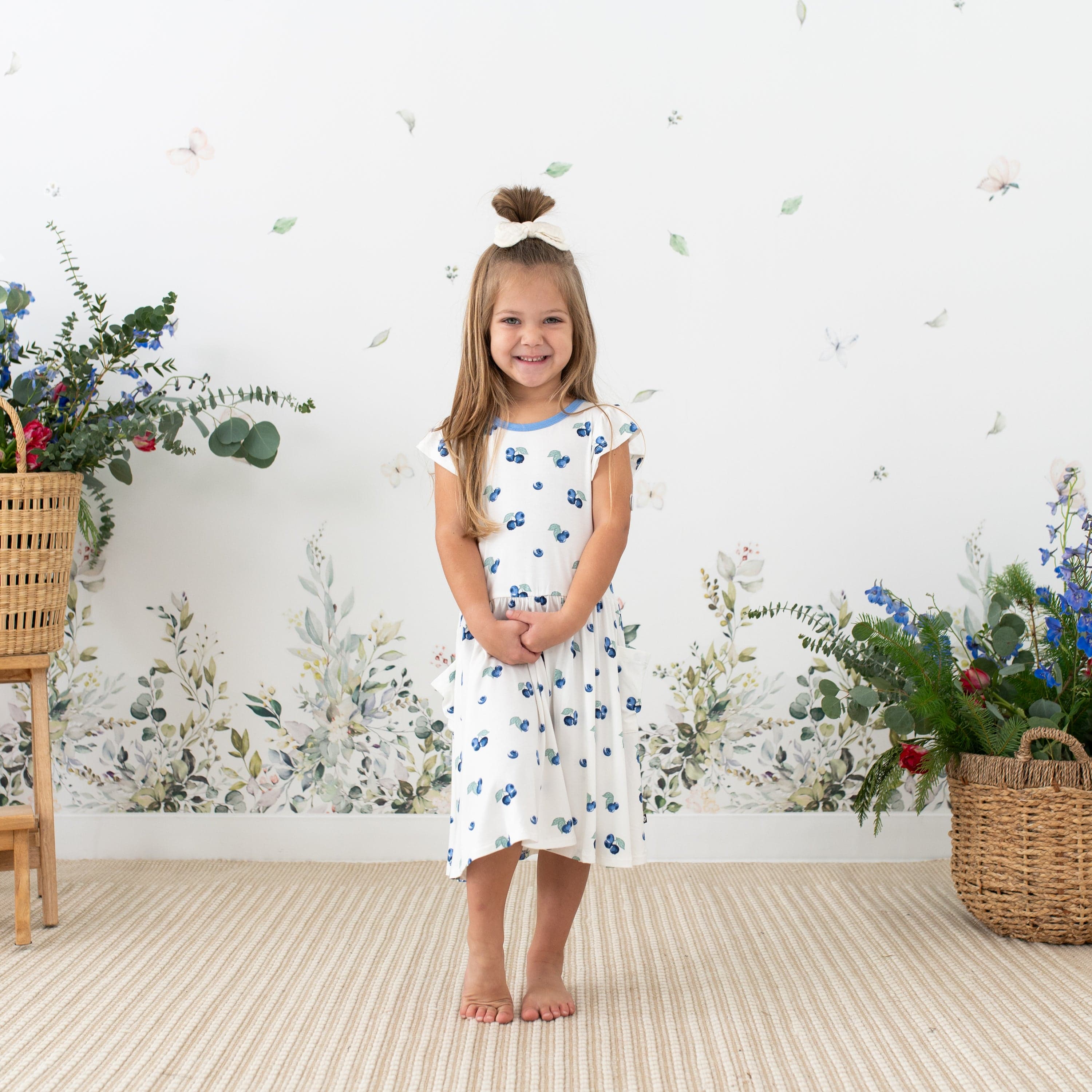 Toddler wearing Kyte Baby Pocket Dress in Blueberry