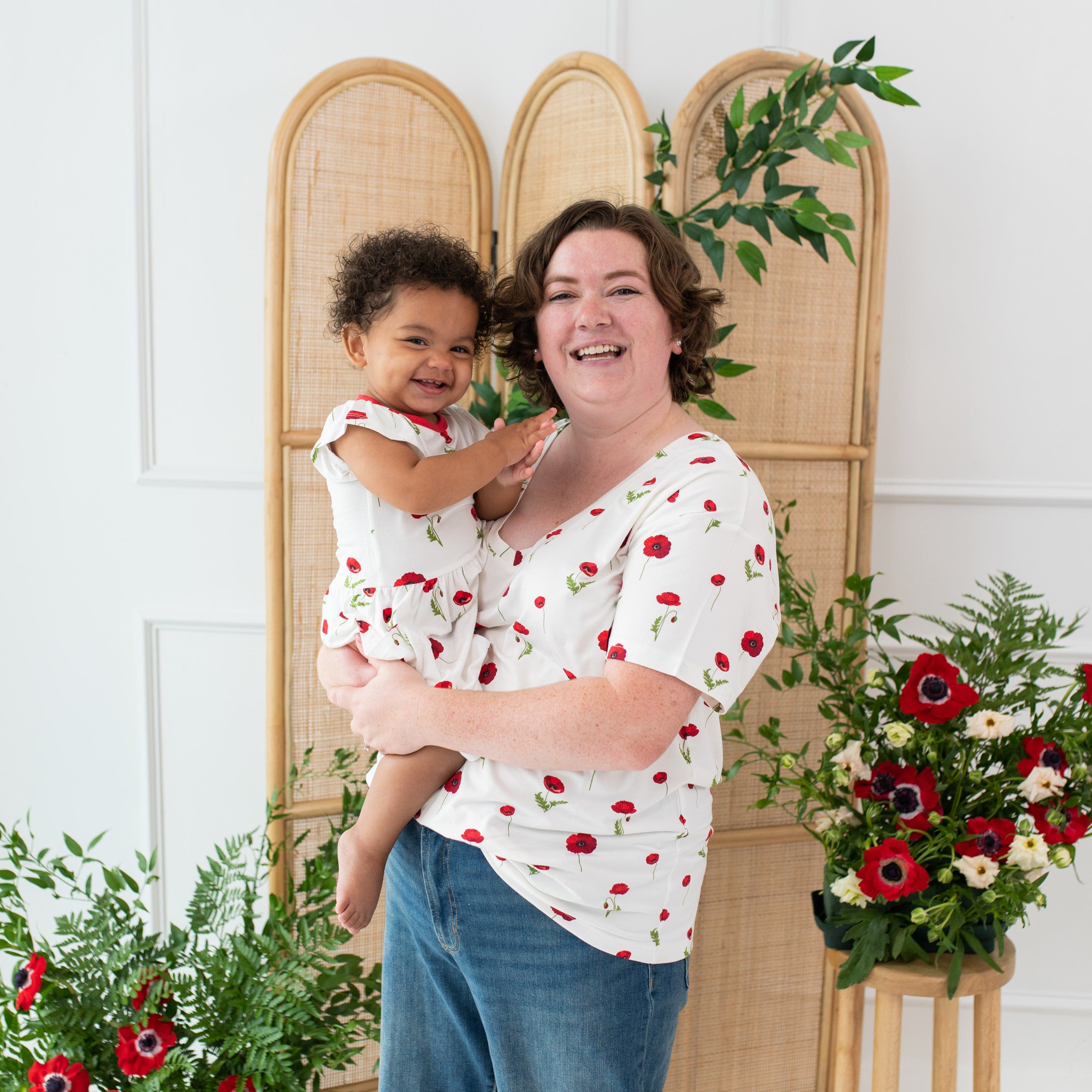 Mom and daughter wearing coordinating Kyte Baby outfits in Cloud Poppies