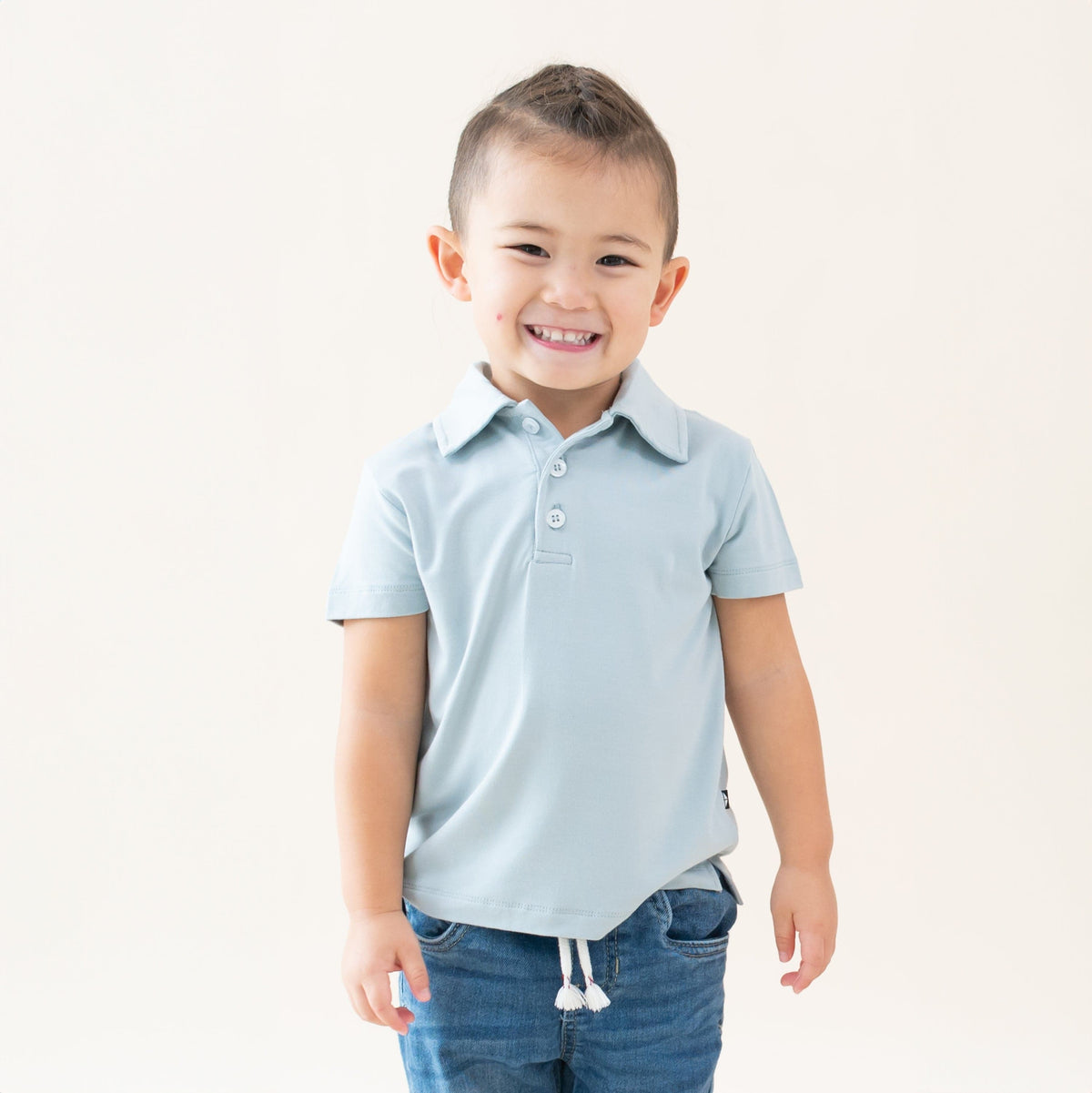 Toddler wearing Kyte Baby Short Sleeve Polo in Fog