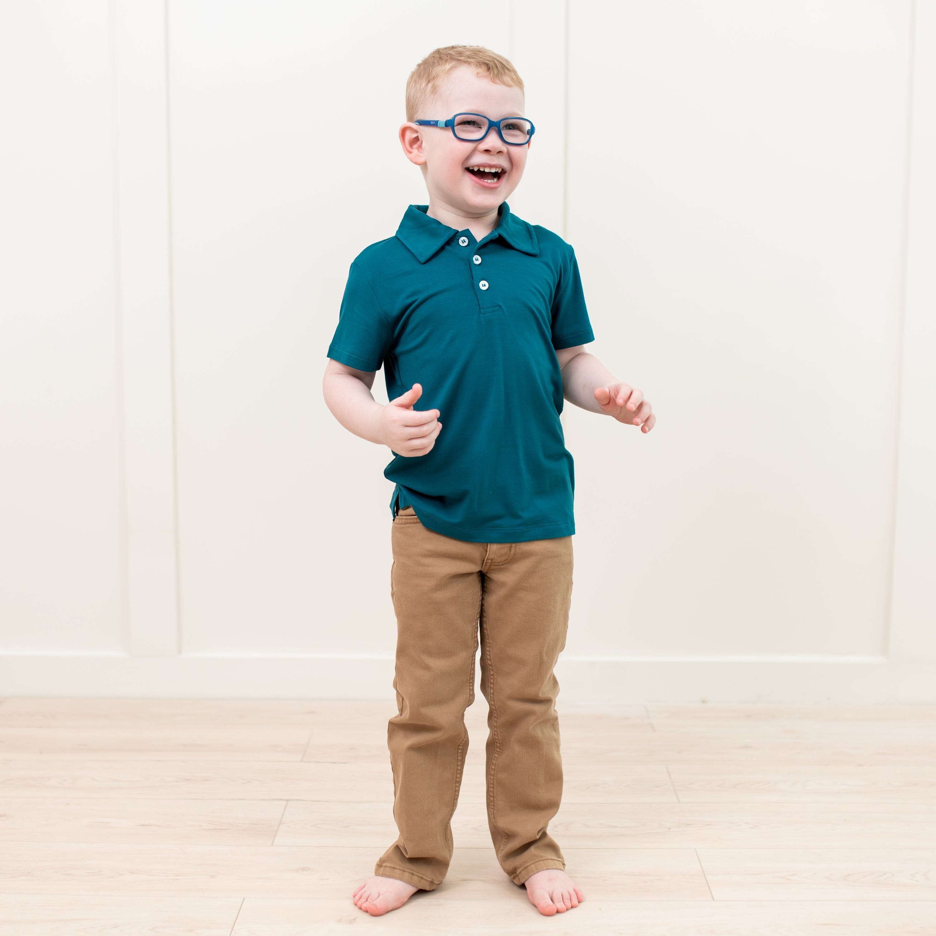 Toddler wearing Kyte Baby Short Sleeve Shirt with Polo Collar in Loch blue